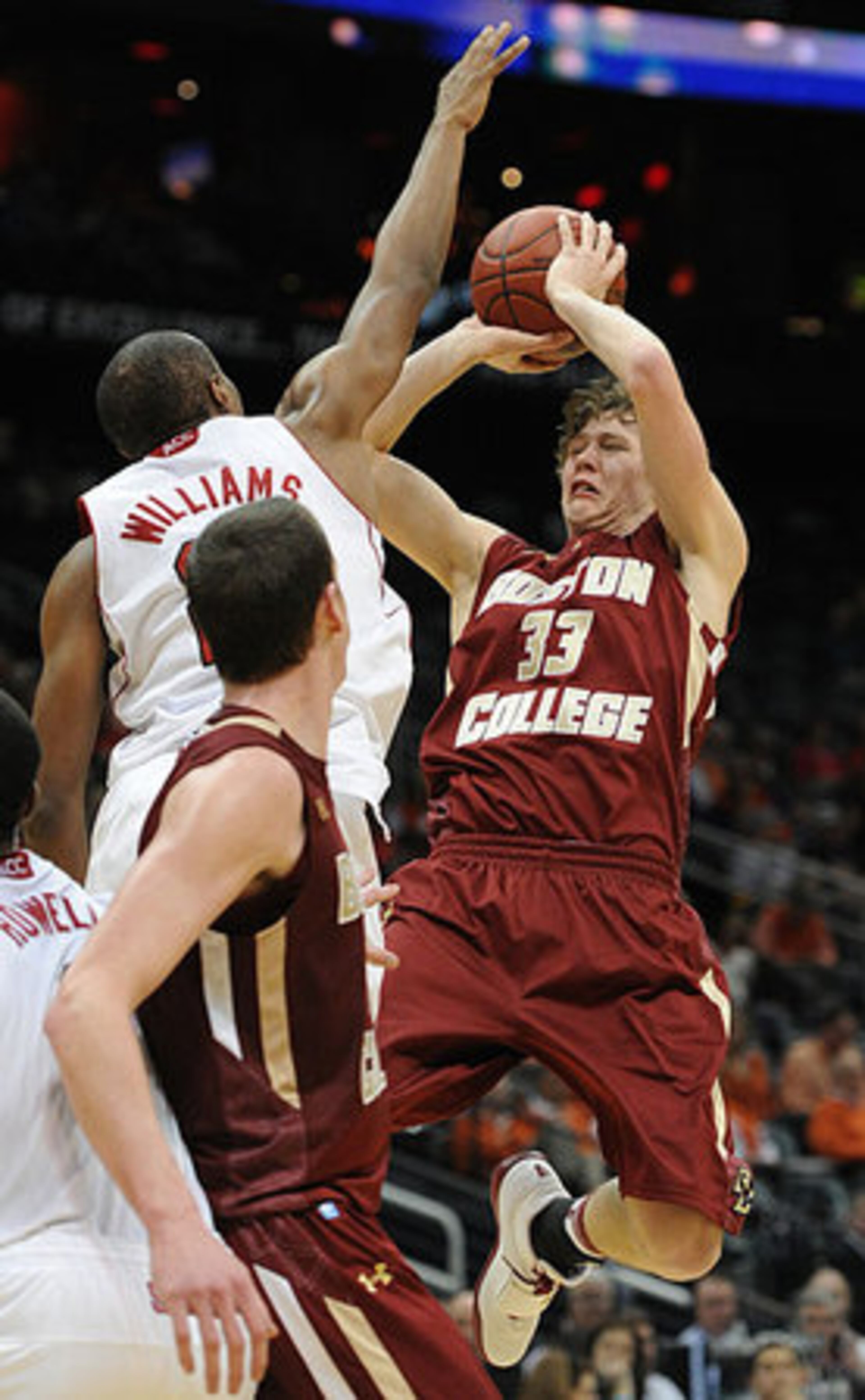 North Carolina State's C.J. Williams reaches up to block Boston College's John Cain Carney's shot during the second game of the 59th Annual ACC Tournament.