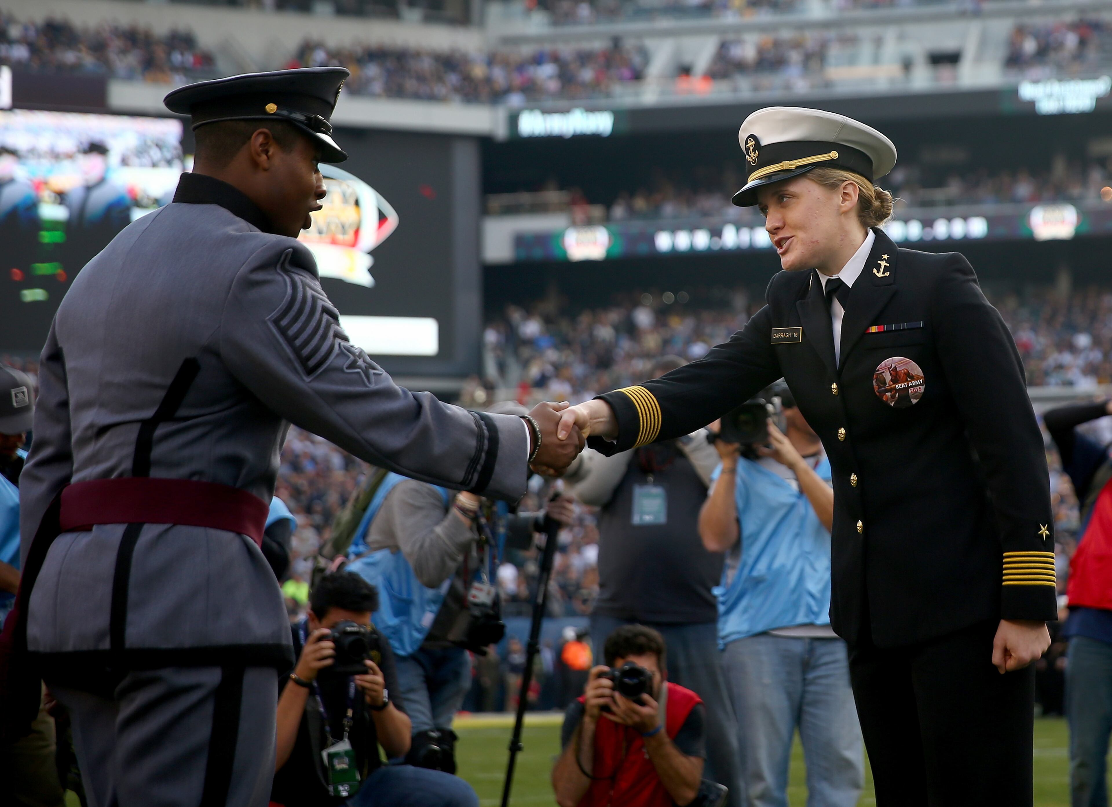 PHILADELPHIA, PA - DECEMBER 12: Representatives of the Army Black Knights and the Navy Midshipmen greet each other at center field before the game between the Army Black Knights and the Navy Midshipmen at Lincoln Financial Field on December 12, 2015 in Philadelphia, Pennsylvania. (Photo by Elsa/Getty Images)