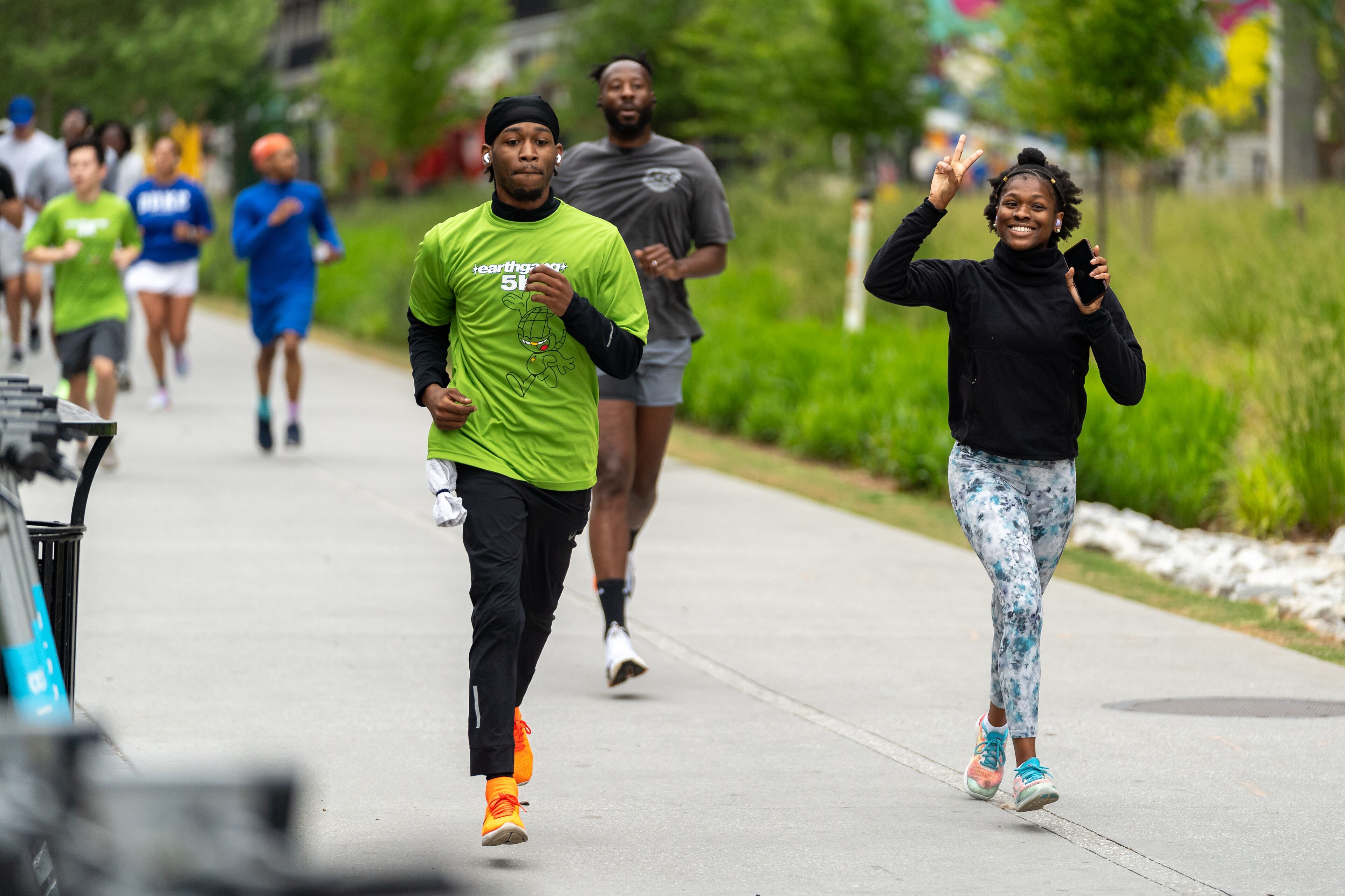 Runners gathered for the first annual Earthgang 5k run on Atlanta's Eastside Beltiline on Saturday, April 17, 2024. Atlanta rap duo Earthgang organized the free through their namesake non-profit foundation, which focuses on sustainability and environmental conservation. (Ben Hendren for The Atlanta Journal-Constitution)