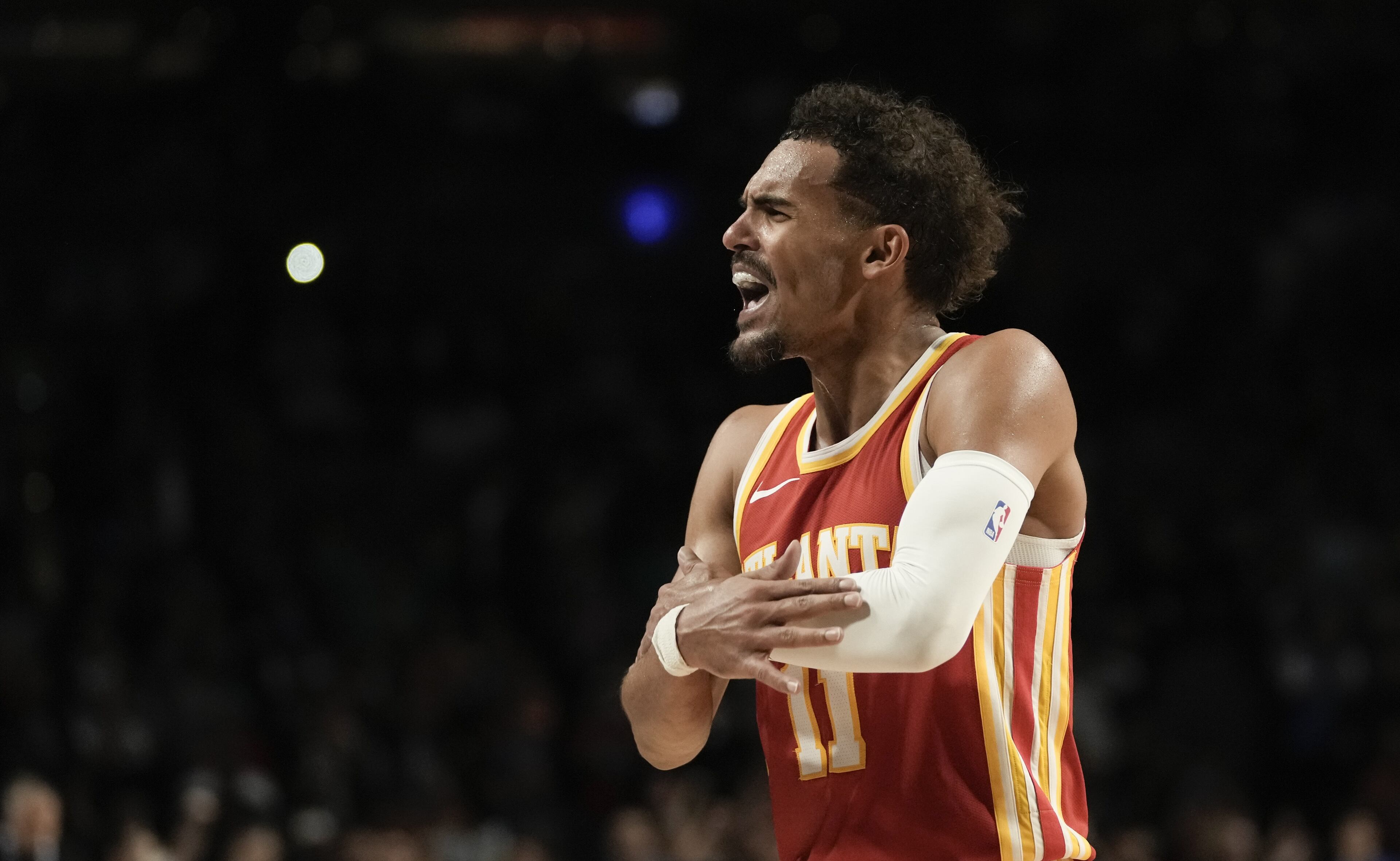 Ice Ice baby: Trae Young with his famous shiver during Thursday's game against the Magic. Hawks star had 41 points in team's 120-119 victory in Mexico City.