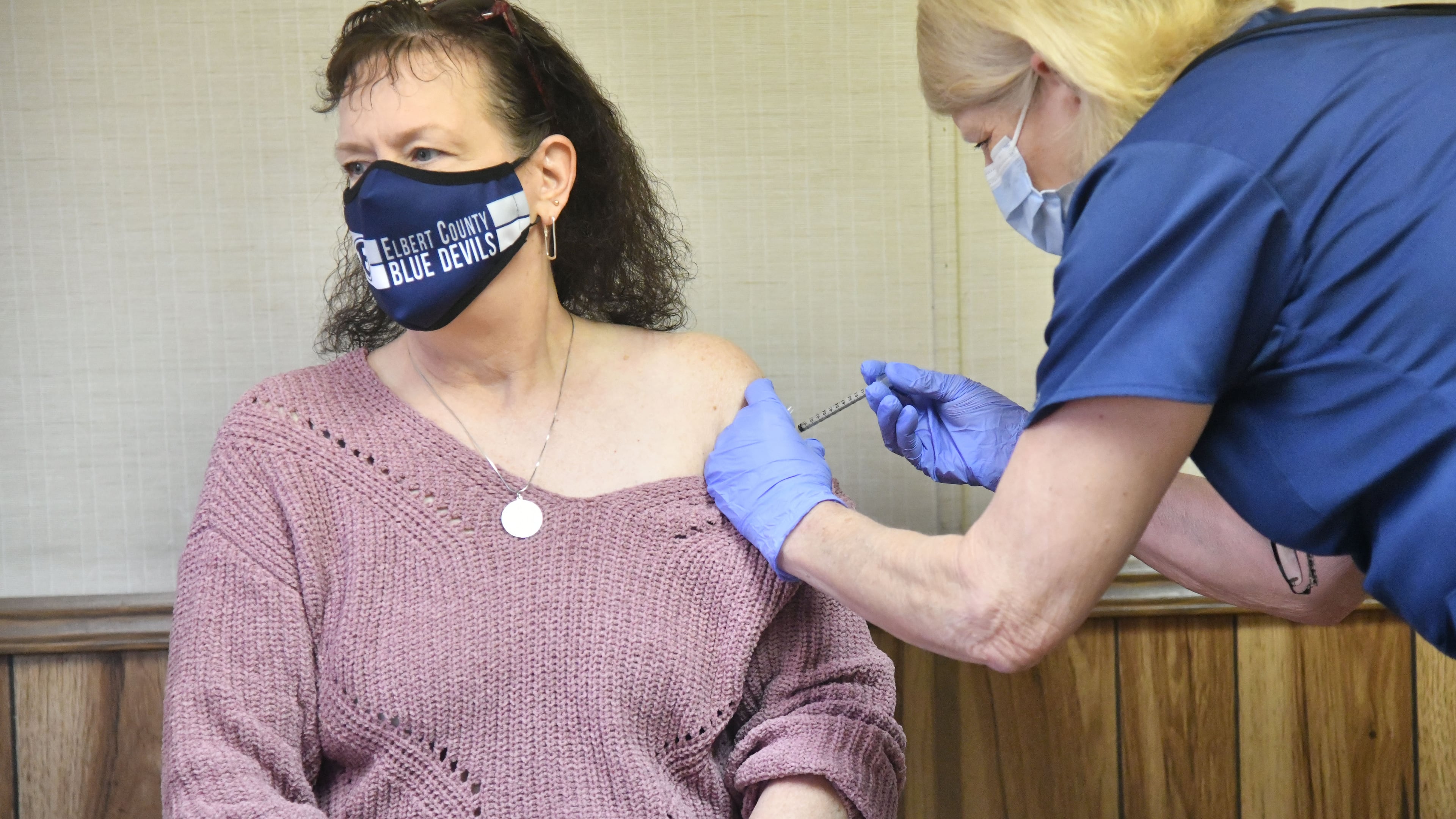 Elbert County High School teacher Tonya Andrews receives her second dose of the COVID-19 vaccine from Tina Mewborne, LPN, at the Medical Center Of Elberton on Wednesday, Jan. 27, 2021. Georgia has not opened COVID-19 vaccination to teachers yet, but a small school district east of Athens still managed to offer shots to any employee who wanted them. Elbert County Superintendent Jon Jarvis told The Atlanta Journal-Constitution that he sees his teachers, bus drivers and other employees as “essential” personnel who should be prioritized for vaccination. (Hyosub Shin / Hyosub.Shin@ajc.com)