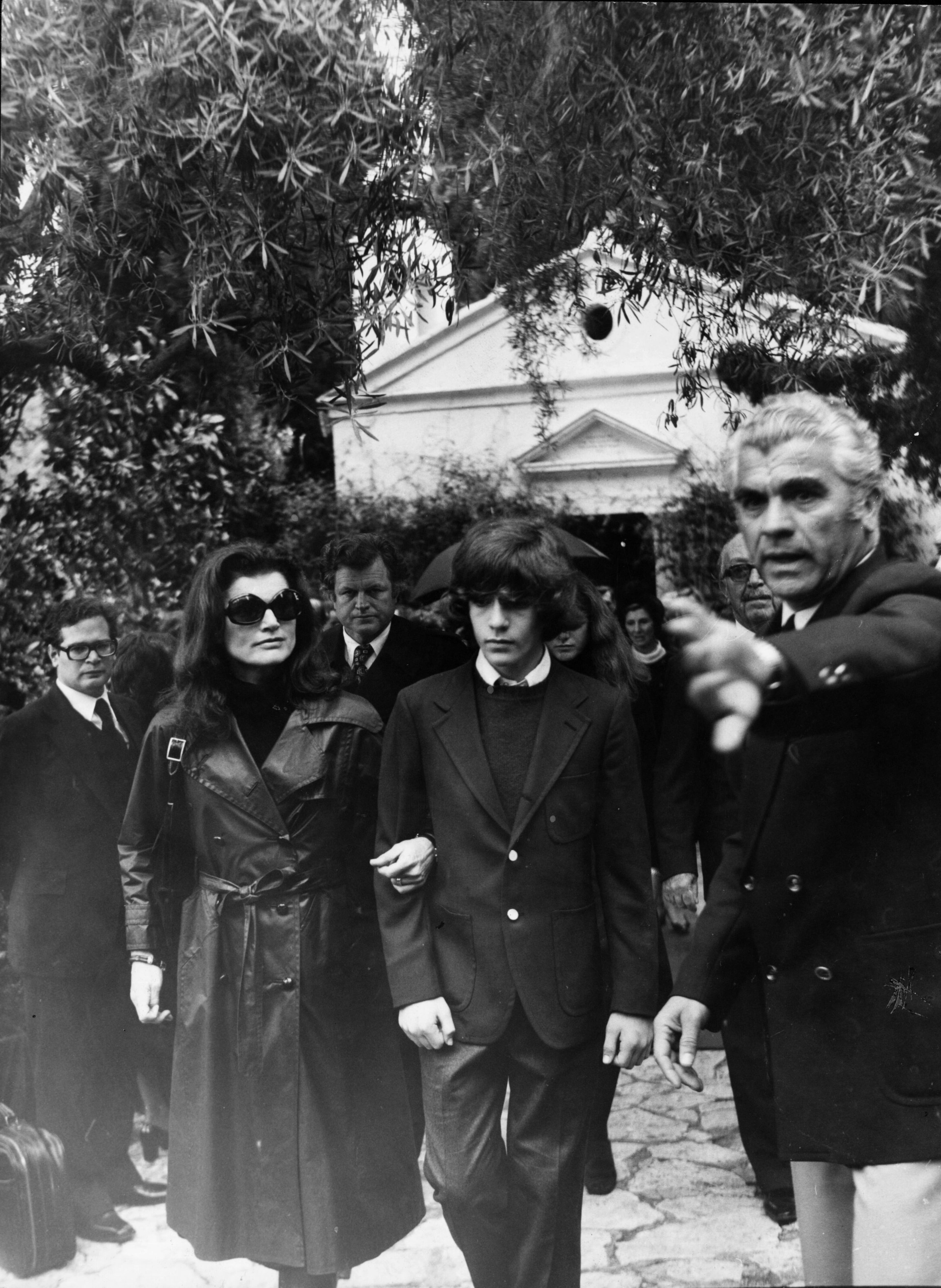 Jacqueline Kennedy Onassis (left) (1929 - 1994) at the funeral of her second husband, Greek millionaire shipping magnate Aristotle Onassis, on the Ionian island of Skorpios. With her is her son, John F. Kennedy Jr. (1960 - 1999). (Photo by Keystone/Getty Images)