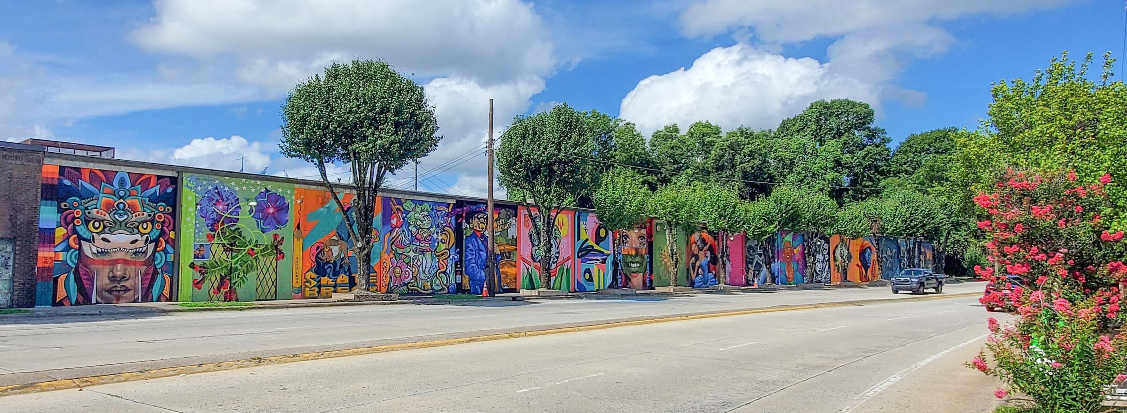 View of the Atlanta Crossroads Mural Festival down Ralph David Abernathy Boulevard. Courtesy of Arthur Rudick