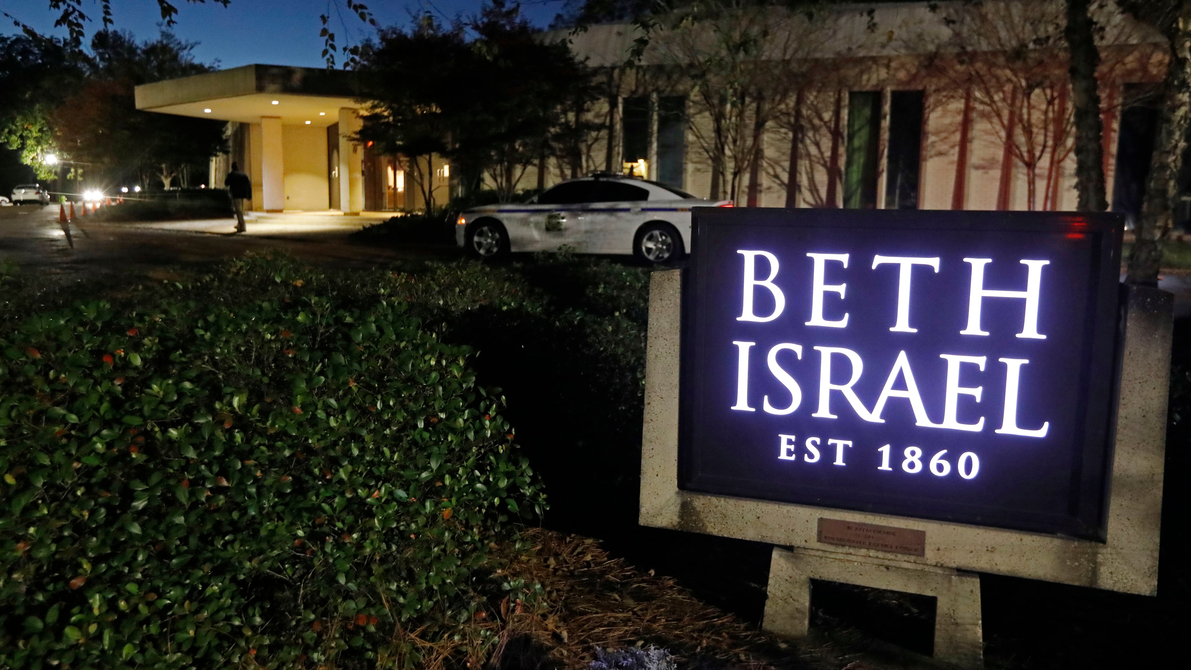 FILE - This Nov. 2, 2018 photo shows an armed Hinds County Sheriff's deputy outside of the Beth Israel Congregation synagogue in Jackson, Miss. (AP Photo/Rogelio V. Solis, file)