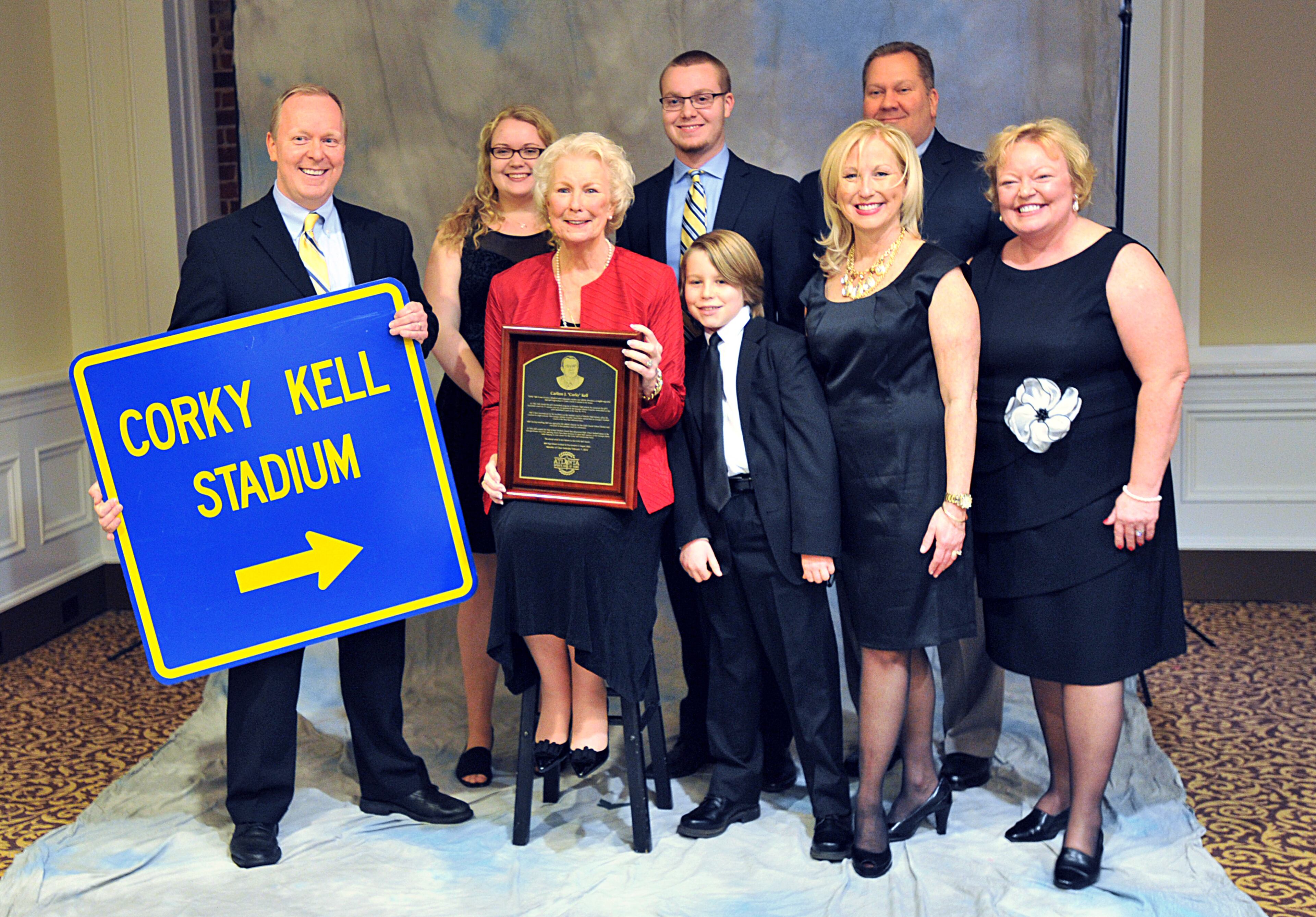 Carole Kell (seated), representing her late husband Corky Kell, poses with family members and friends for a group picture before the Atlanta Sports Hall of Fame 10th Anniversary induction ceremony at Buckhead Theater in Atlanta on Friday, February 7, 2014. The Atlanta Sports Hall Of Fame is dedicated to honoring Atlanta's sports heroes, remembering great moments in Atlanta's sports history, and preserving the past from which future generations can learn and take pride. Ted Turner, John Smoltz, George Rogers, Antonio McKay, Cindy Brogdon and Corky Kell were inducted into the hall during a ceremony. HYOSUB SHIN / HSHIN@AJC.COM