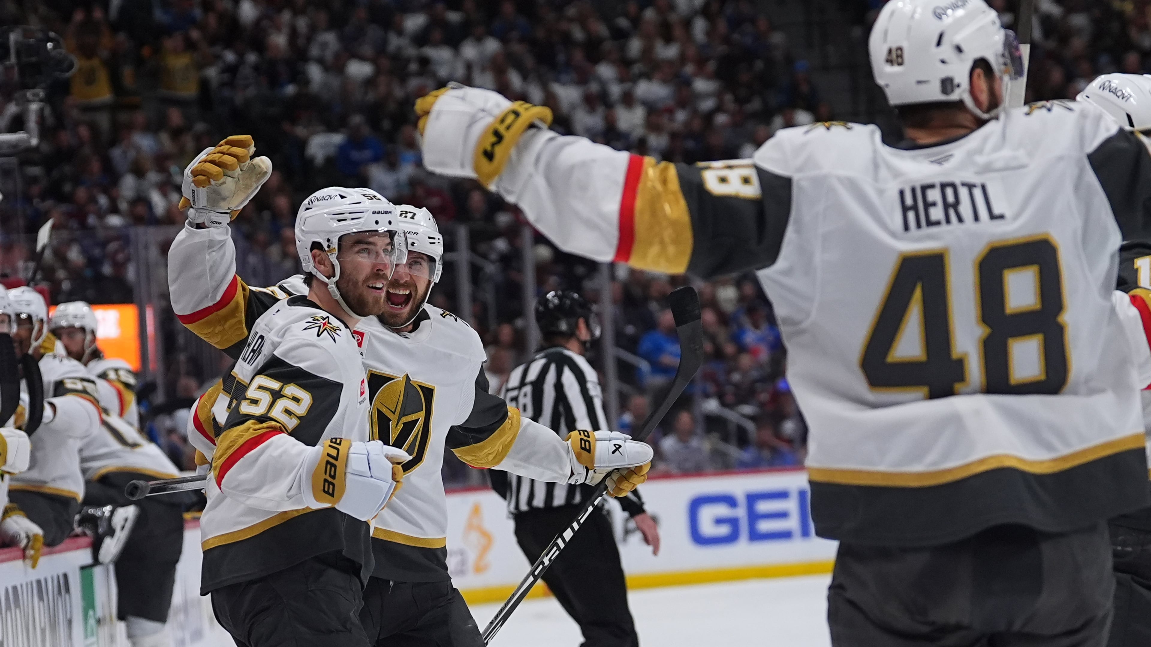 Vegas Golden Knights defenseman Dylan Coghlan, front left, is congratulated after scoring a goal by defenseman Shea Theodore, back left, and center Tomas Hertl during the second period in Game 1 of the Western Conference finals NHL hockey Stanley Cup playoff series against the Colorado Avalanche Wednesday, May 20, 2026, in Denver. (AP Photo/David Zalubowski)