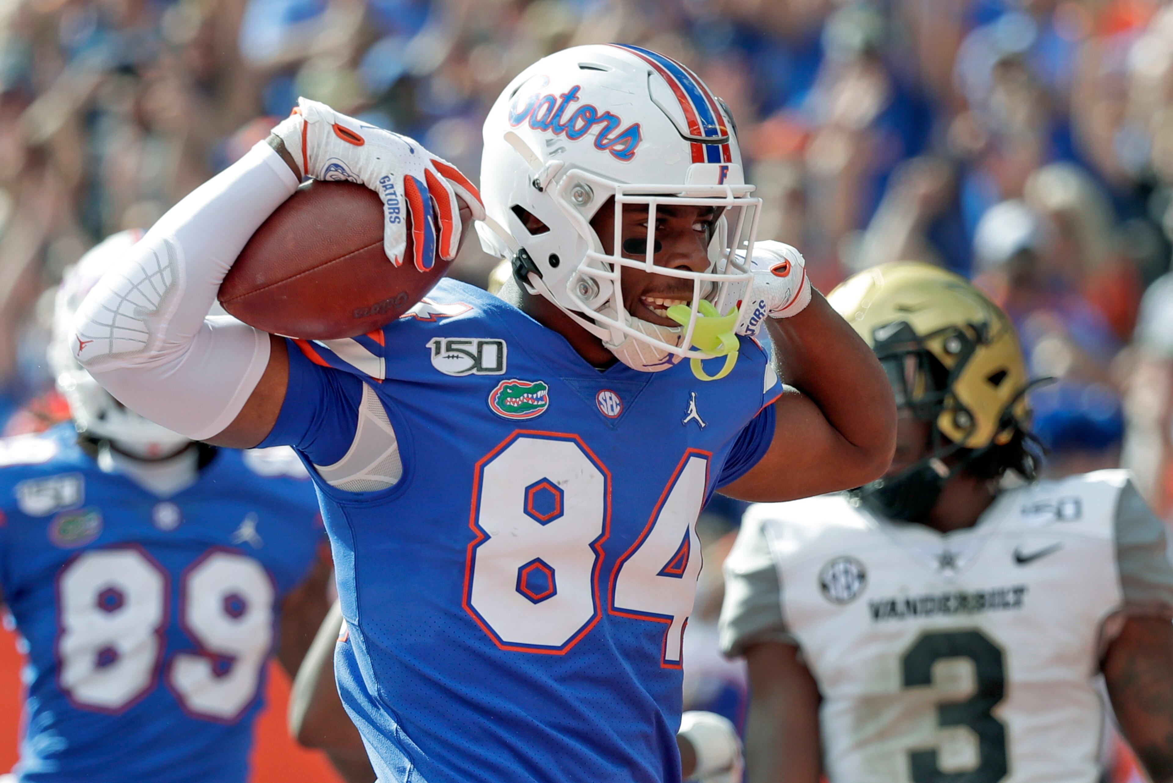 Florida tight end Kyle Pitts (84) celebrates after scoring a touchdown on a 15-yard pass reception during the second half of an NCAA college football game against Vanderbilt, in Gainesville, Fla. (AP Photo/John Raoux, File)