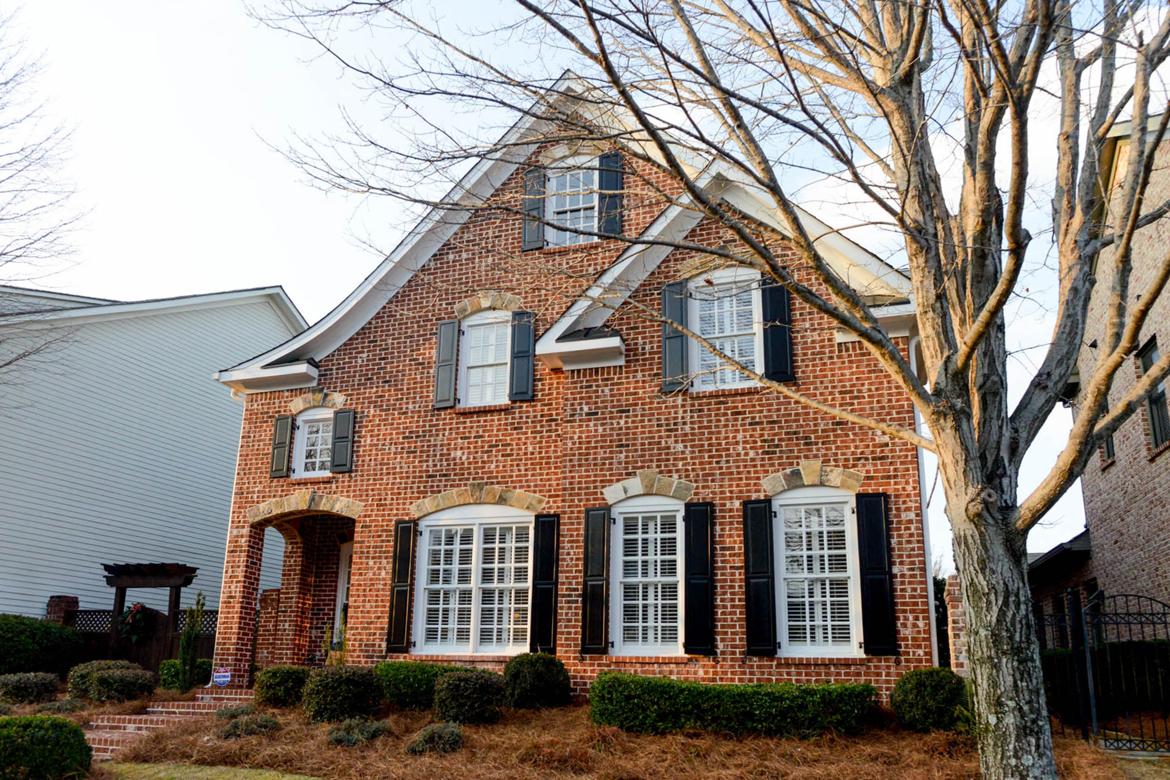 The three-bedroom, three-and-a-half-bath Craftsman-style home in Alpharetta's Palisades at Milton Park was built in 2002 by Monte Hewett Homes. The homeowners say the brick and stone exterior and archways are their favorite architectural elements in the 2800-square-foot home.