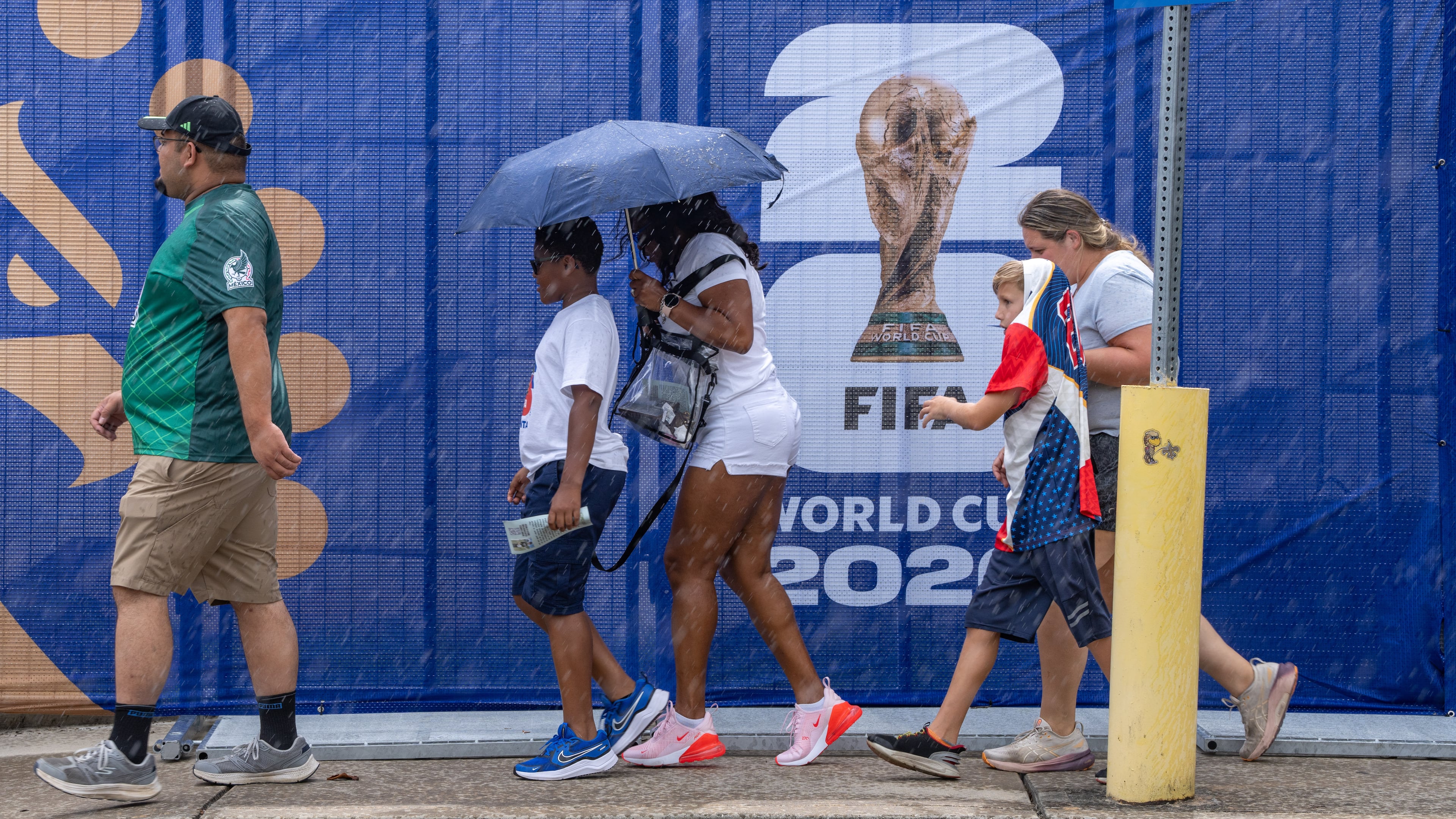 Soccer fans walk in the rain to Atlanta Stadium for the South Africa vs. Czechia match on Thursday, June 18, 2026. (Ben Hendren for the AJC)