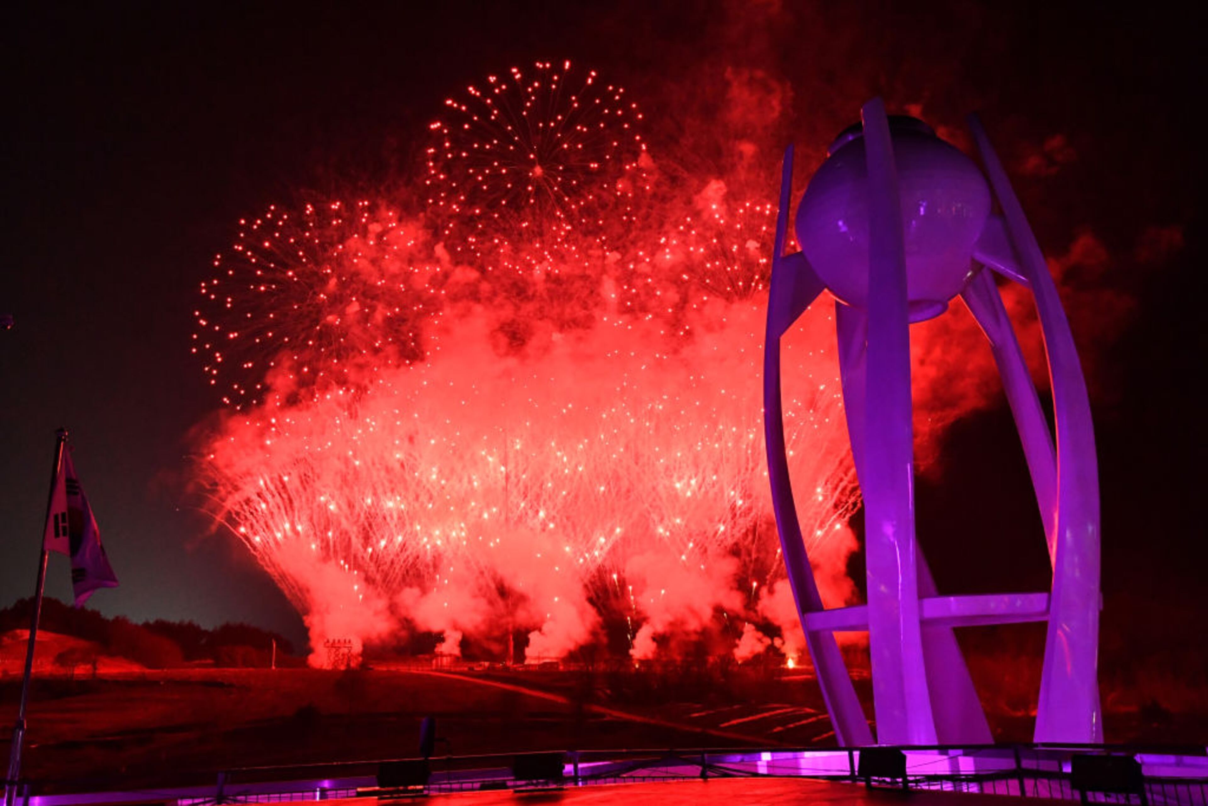 PYEONGCHANG-GUN, SOUTH KOREA - FEBRUARY 25: Fireworks explode behind the extinguished Olympic Cauldron near the conclusion of the Closing Ceremony of the PyeongChang 2018 Winter Olympic Games at PyeongChang Olympic Stadium on February 25, 2018 in Pyeongchang-gun, South Korea. (Photo by Florien Choblet - Pool/Getty Images)