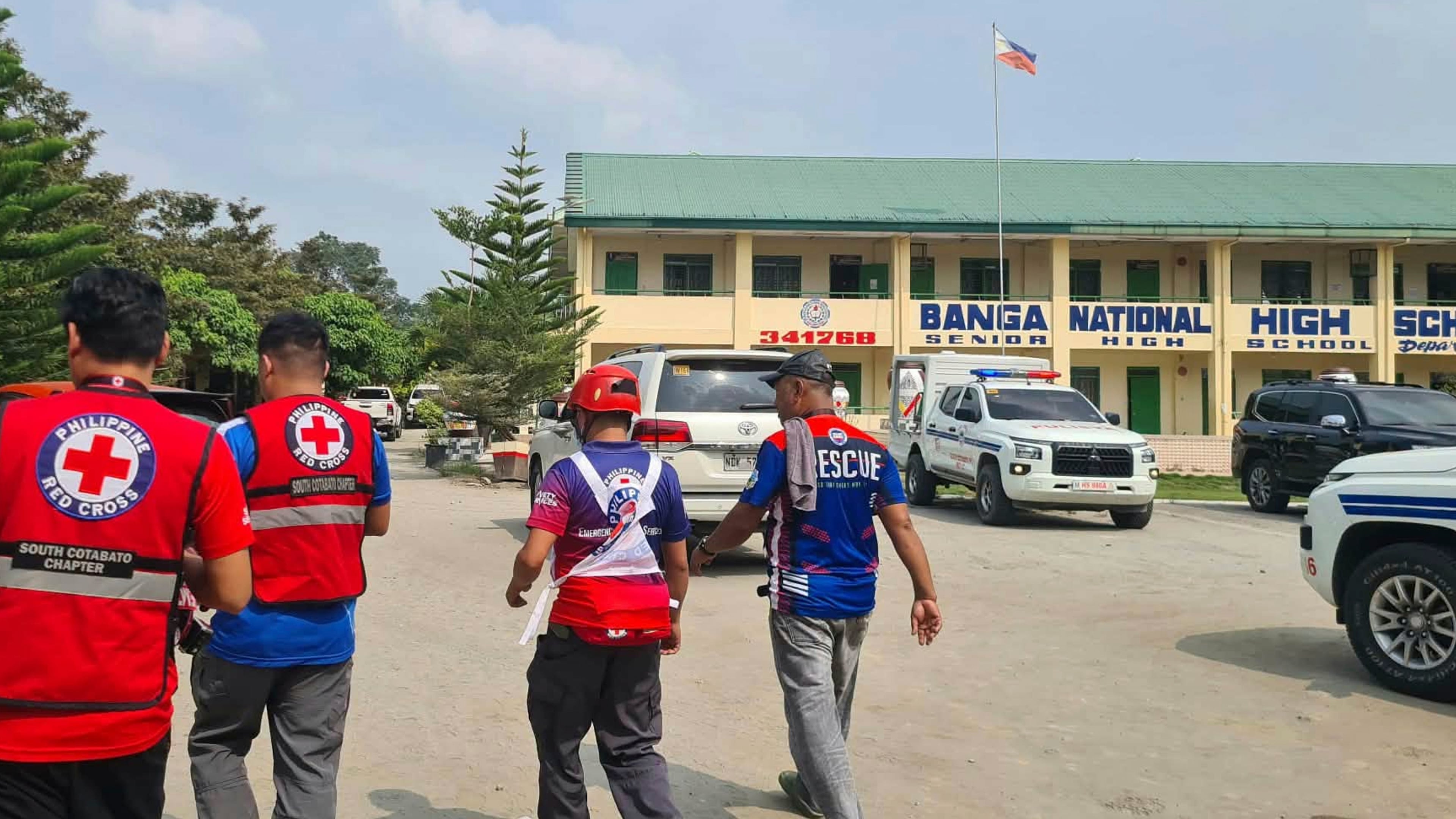 In this handout photo provided by the Philippine Red Cross, Red Cross members arrive at Banga National High School in the town of Banga, Philippines, Friday, Sept. 18, 2026. (Philippine Red Cross via AP)