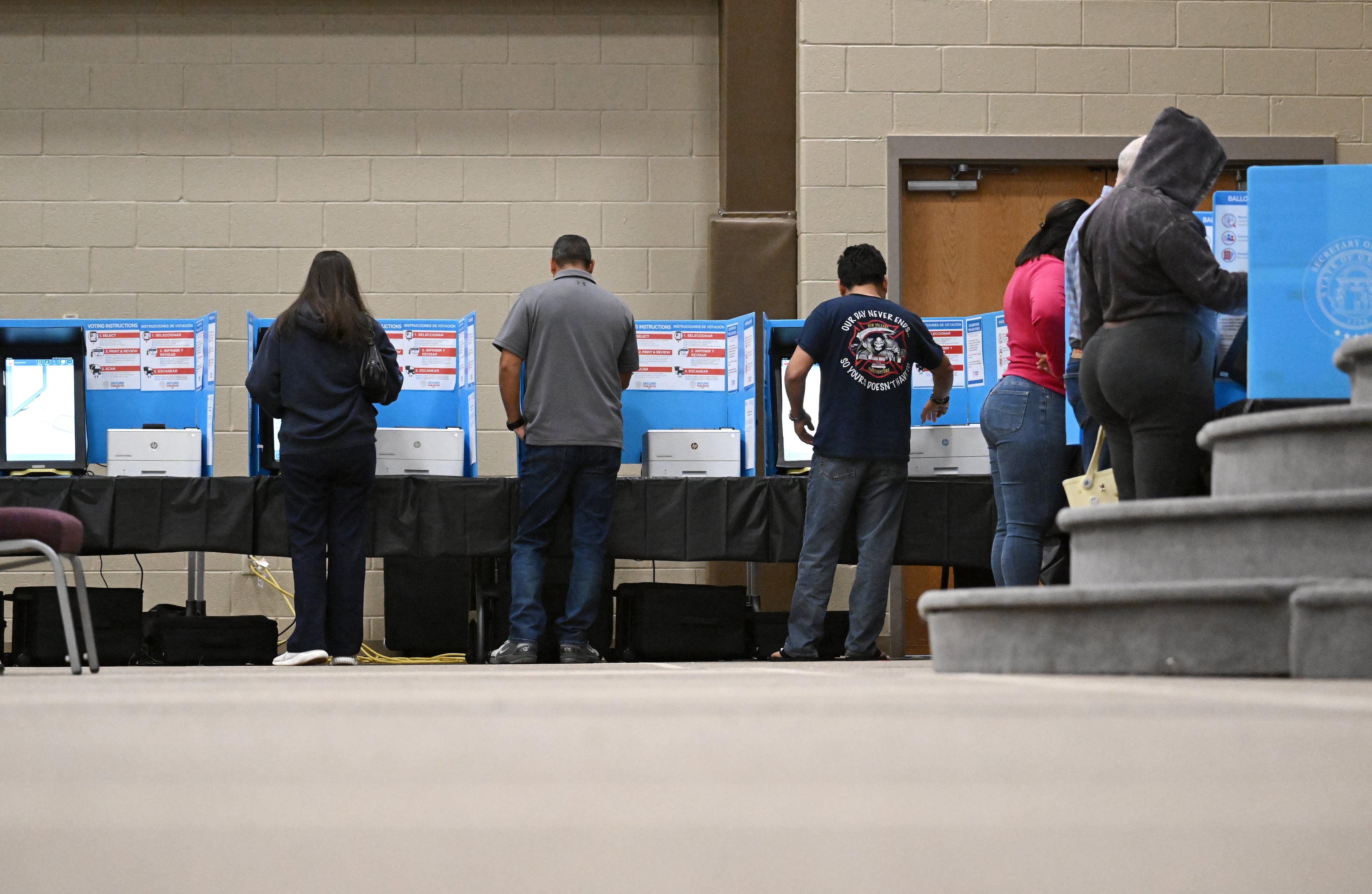 Gwinnett County voters cast their ballots on Election Day in Loganville in 2024. (Hyosub Shin/AJC)