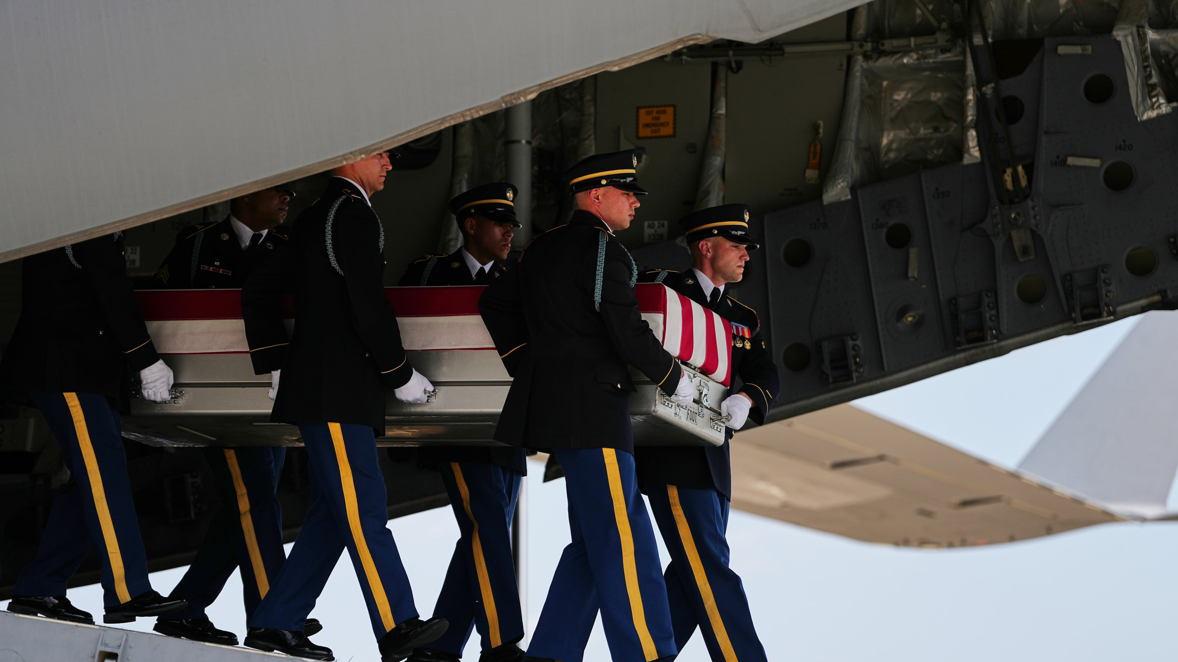 A U.S. Army carry team moves a transfer case containing the remains of 1st Lt. Tyler James Feehan of Ewa Beach, Hawaii, Wednesday, July 22, 2026, at Dover Air Force Base, Del. (AP Photo/Matt Rourke)