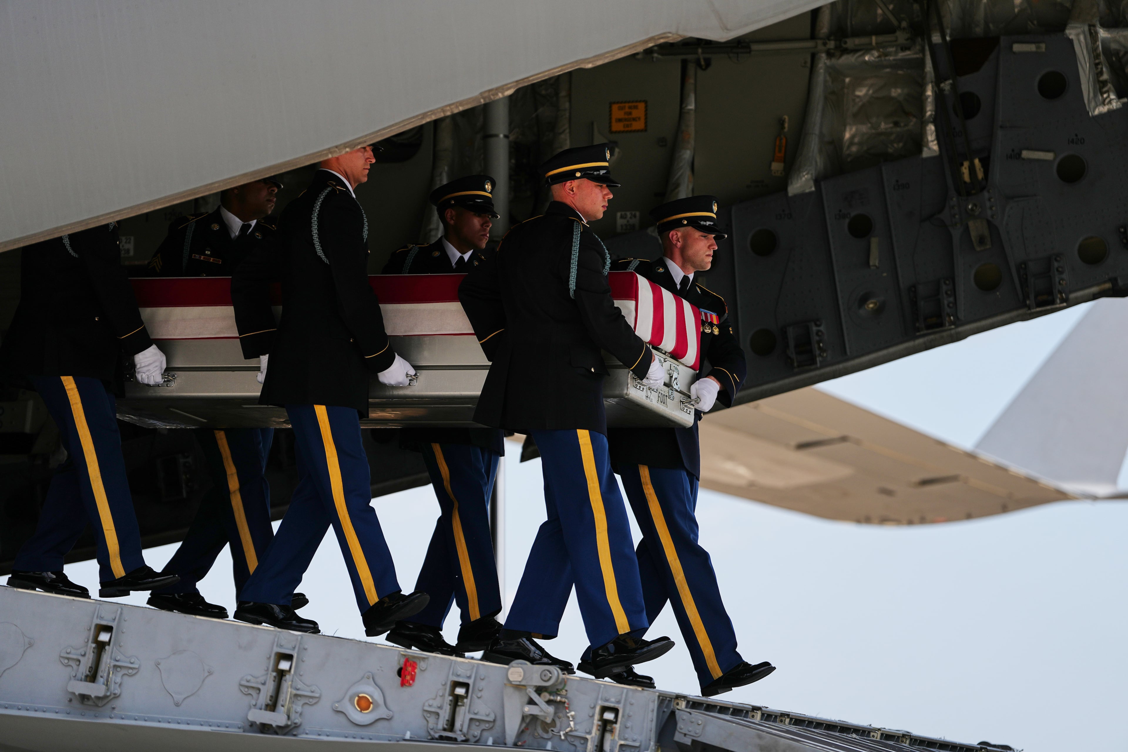 A U.S. Army carry team moves a transfer case containing 1st Lt. Tyler James Feehan on Wednesday, July 22, 2026, at Dover Air Force Base, Delaware. (Matt Rourke/AP)