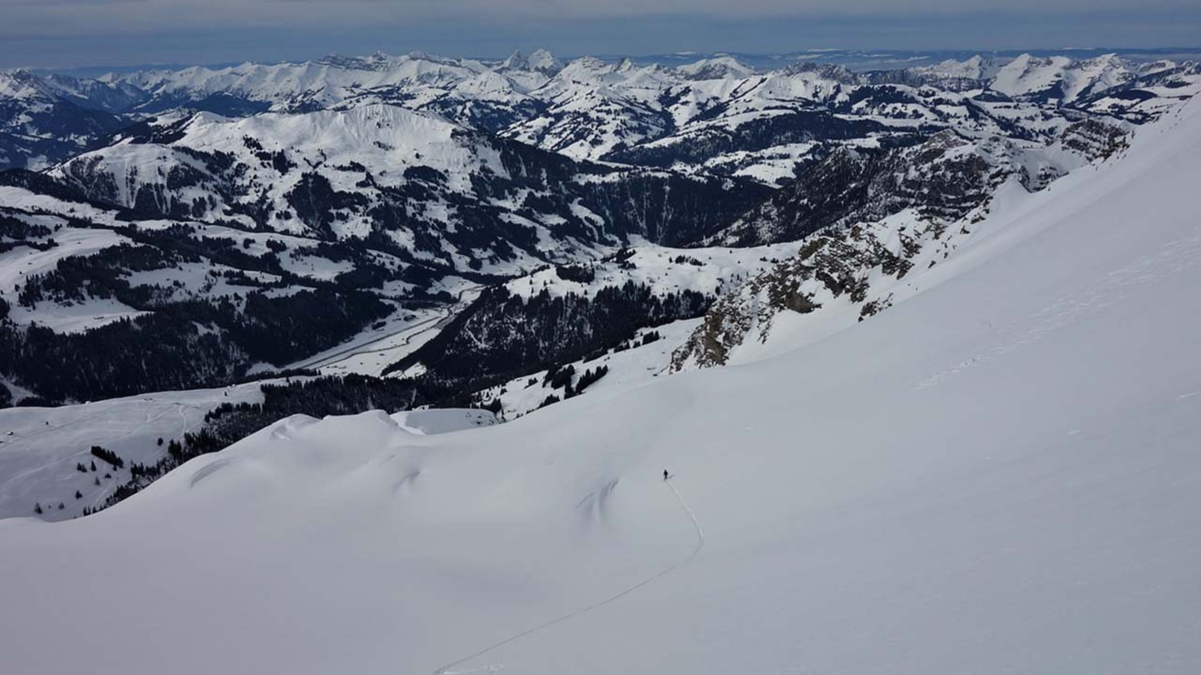 A mountainous view from a snow-covered peak. Avalanches area real danger during the winter in Colorado's back country and even in area's like I-70, where a driver recorded an avalanche barreling toward the highway Sunday.