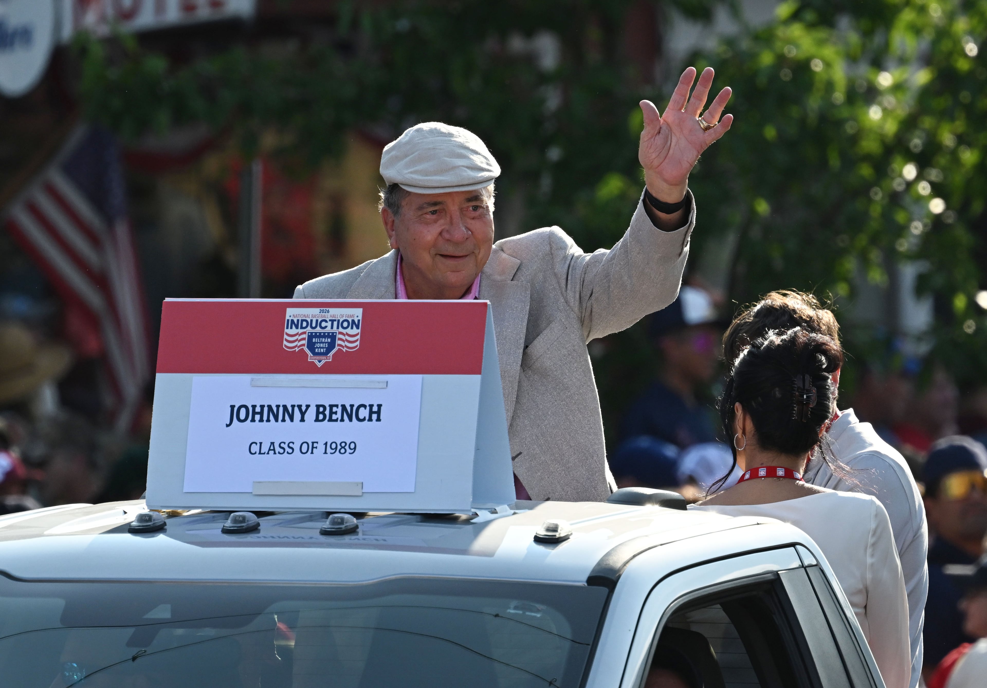 National Baseball Hall of Fame member Johnny Bench waves to spectators from the back of a pickup truck during the Hall of Fame Legends Parade on Saturday, July 25, 2026, in Cooperstown, N.Y. (Hyosub Shin/AJC)