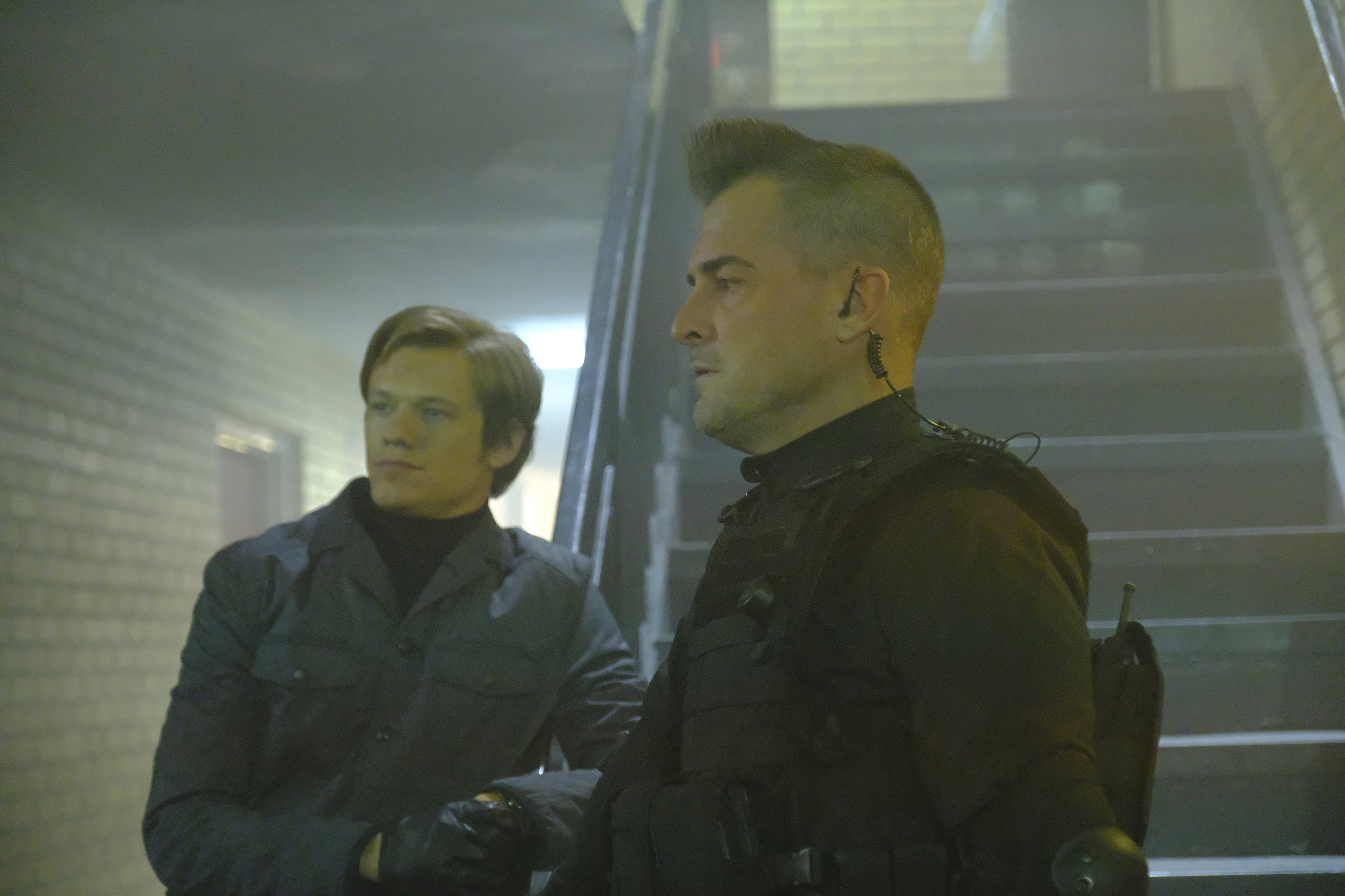 "Hole Puncher" -- When the team intercepts a terror group's message meant for Murdoc, Mac poses as the psychopath to save the intended target and find out why they want Murdoc to assassinate him, on MACGYVER, Friday, April 7 (8:00-9:00 PM, ET/PT) on the CBS Television Network. Pictured: Lucas Till, George Eads. Photo: Guy D'Alema/CBS é2017 CBS Broadcasting, Inc. All Rights Reserved
