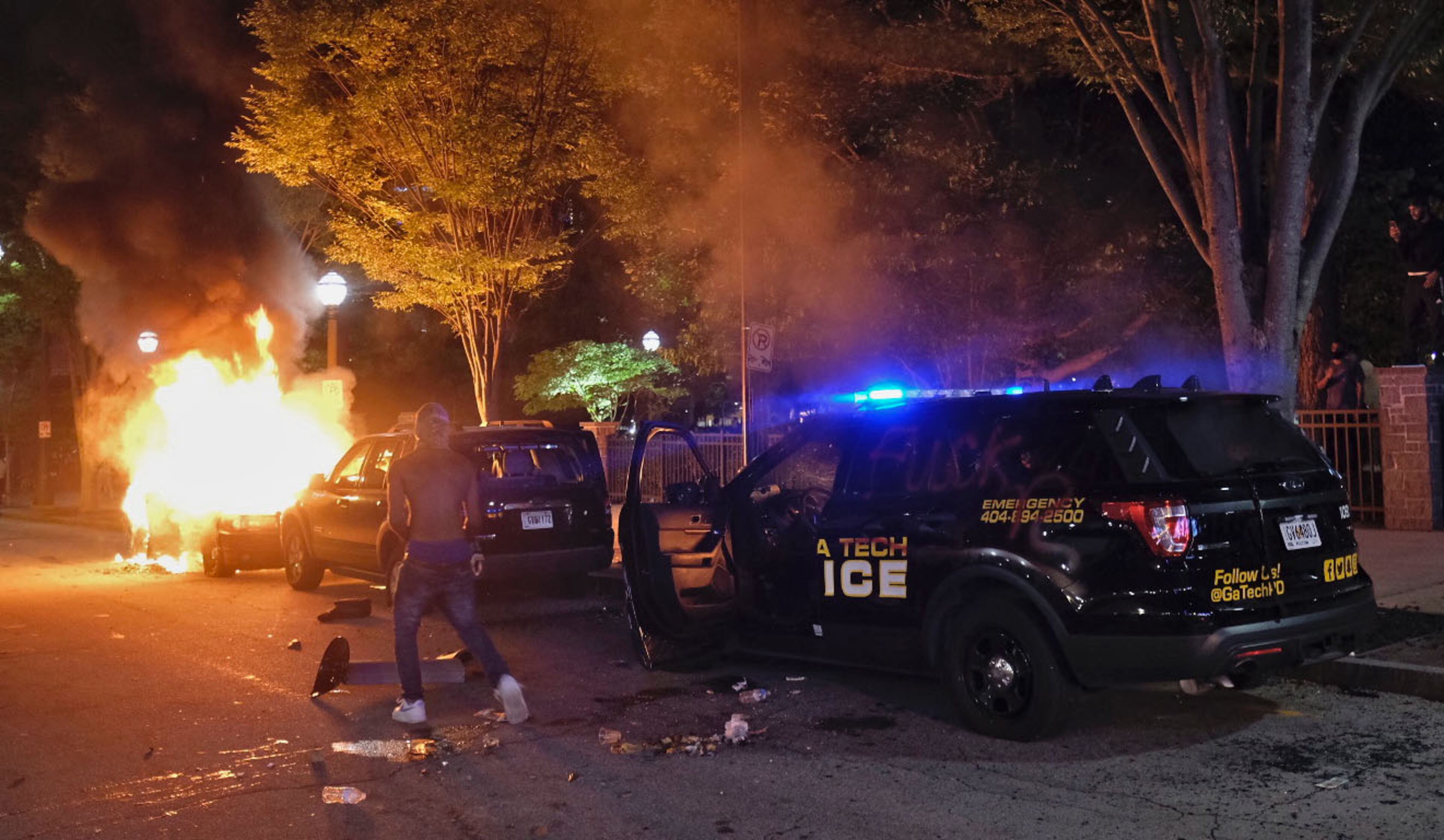 May 29, 2020 - Atlanta - After a peaceful march the Georgia State Capitol that swelled into the hundreds, protestors returned to the area around the Centennial Olympic Park and CNN center where some confronted police, who sprayed some demonstrators with pepper spray. They carried signs and chanted their messages of outrage over the death of George Floyd in Minneapolis. Ben Gray for the Atlanta Journal Constitution
