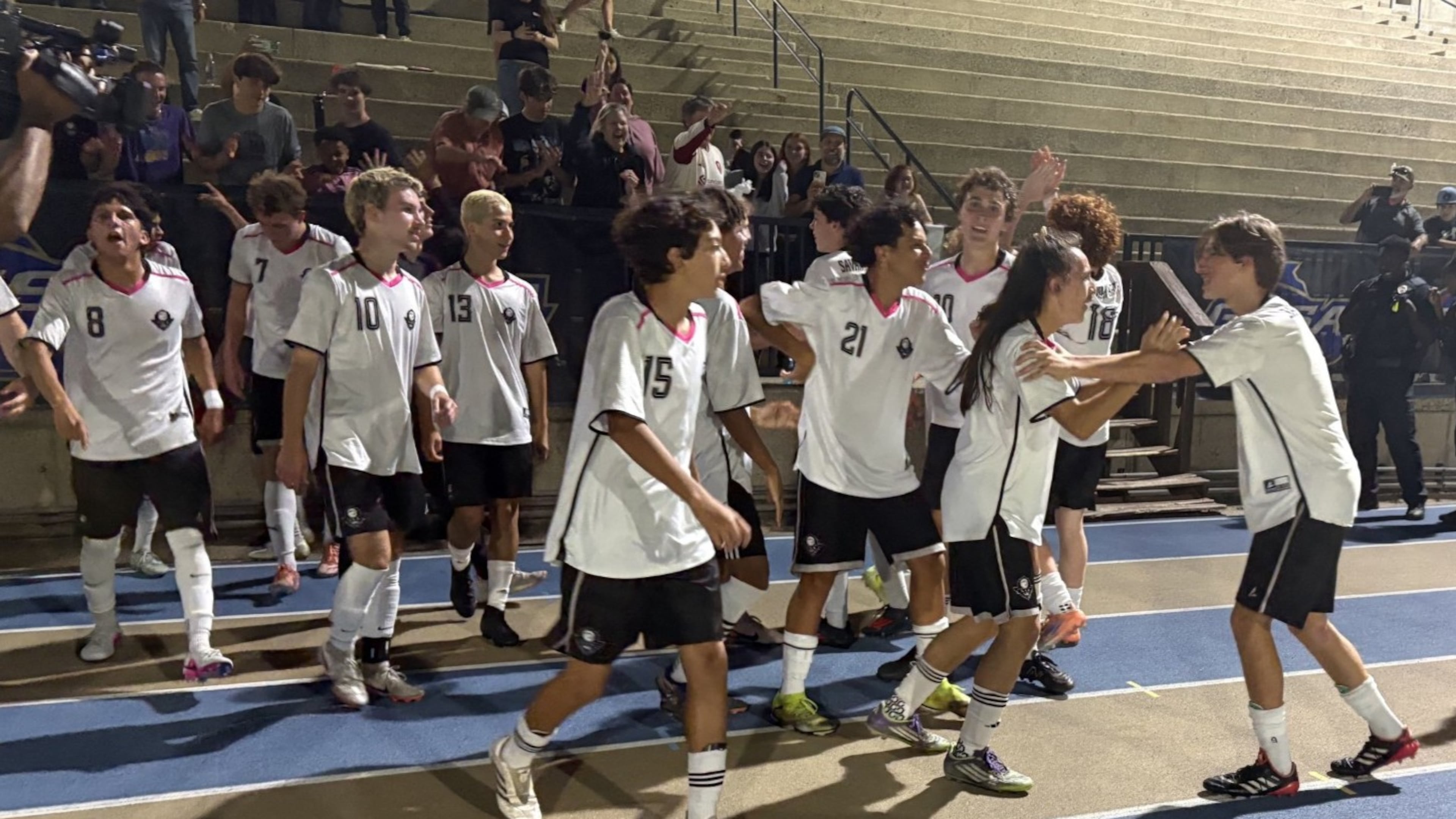 Savannah Arts Academy players celebrate in front of their fans after defeating Pierce County 2-0 in the Class 2A boys soccer championship on May 13, 2026, at St. Pius X High School in Atlanta.