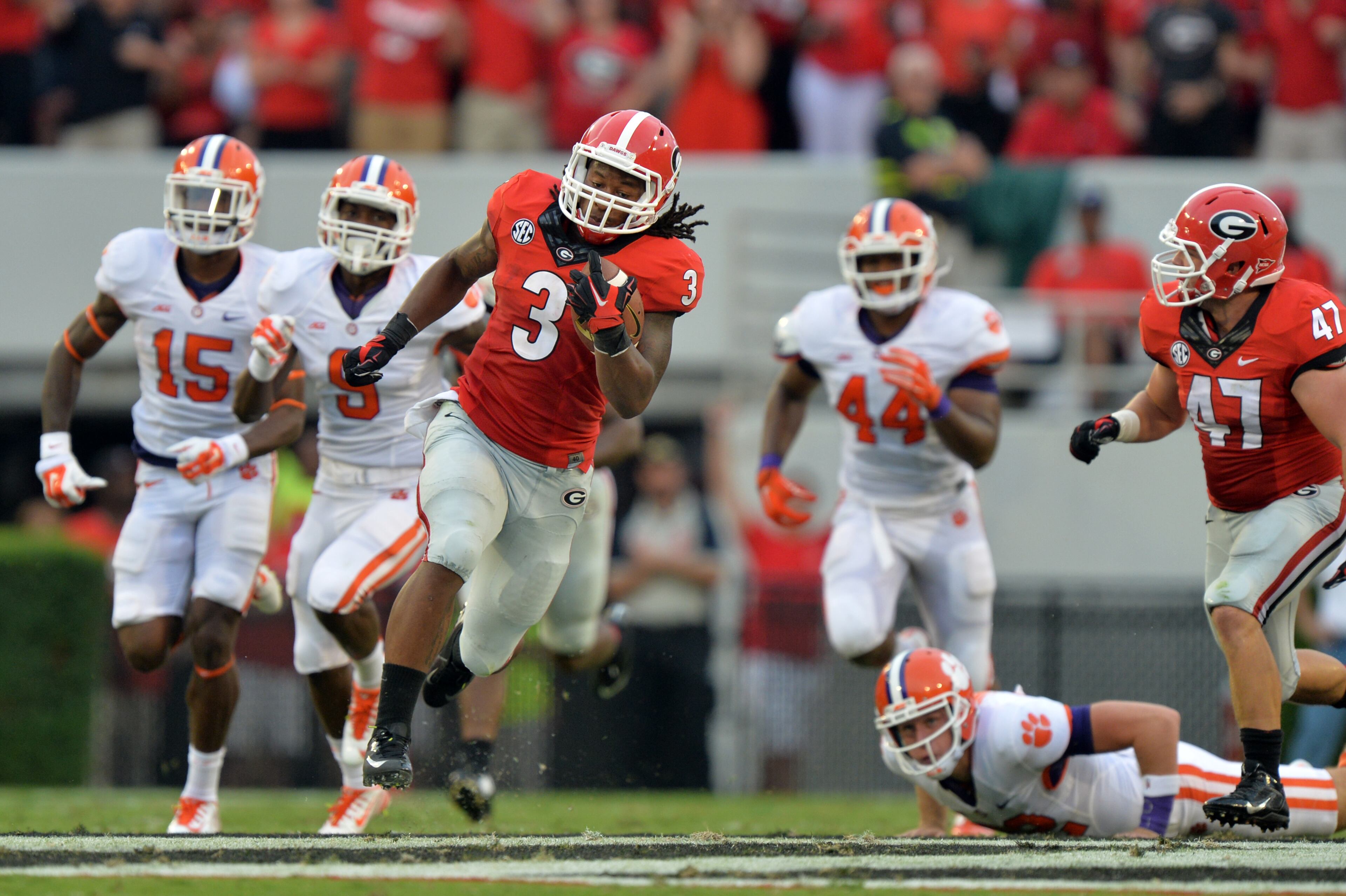 August 30, 2014 Athens, GA:Georgia Bulldogs running back Todd Gurley in route to a 100 yard kickoff return against Clemson during the first half Saturday August 30, 2014 in Athens. BRANT SANDERLIN / BSANDERLIN@AJC.COM .