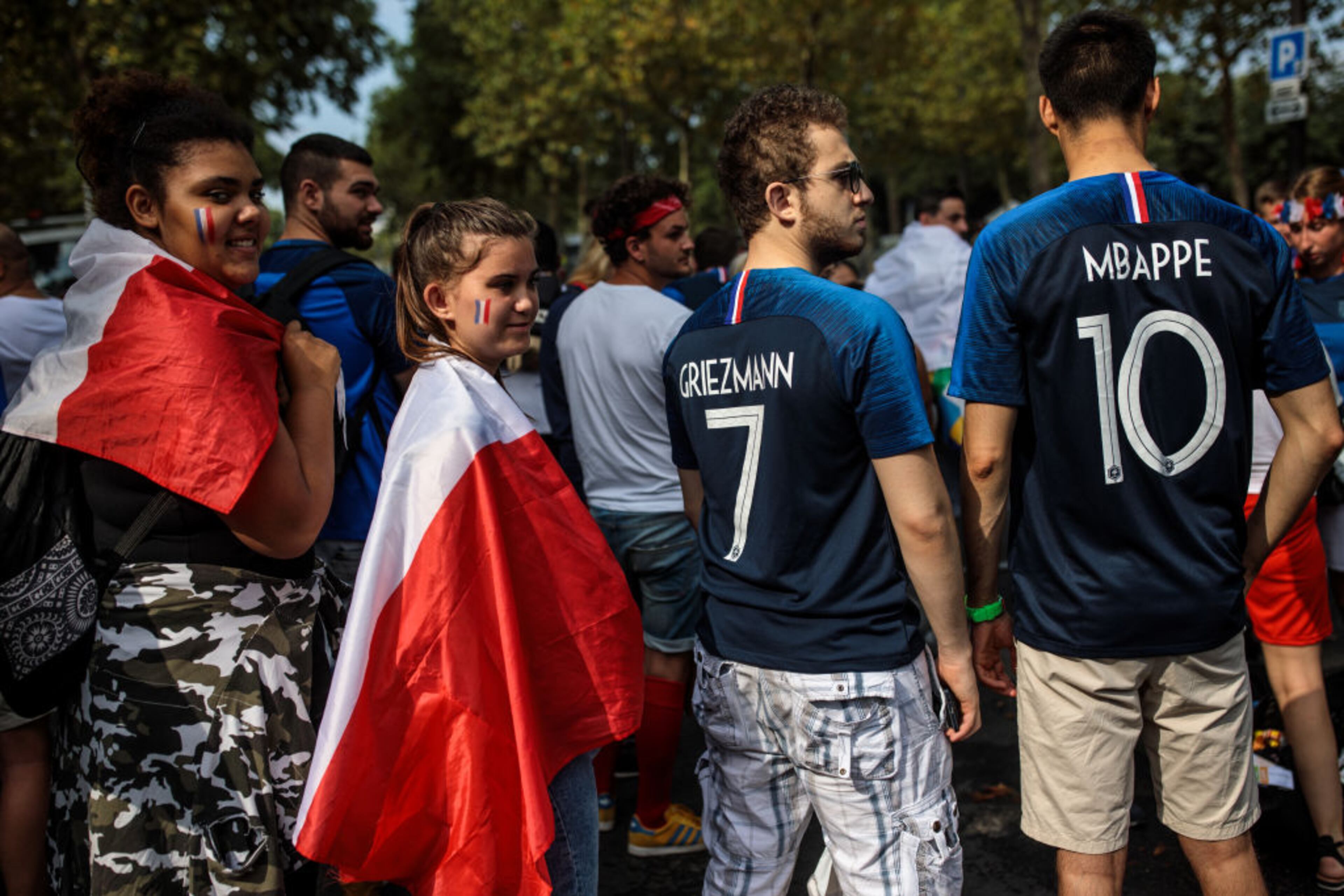 PARIS, FRANCE - JULY 15: French football fans gather outside the Champs-de-Mars fan zone ahead of the FIFA 2018 World Cup Final match between France and Croatia on July 15, 2018 in Paris, France. The World Cup Final is shown tonight on giant screens across France as Croatia face France at Moscow's Luzhniki Stadium. (Photo by Jack Taylor/Getty Images)