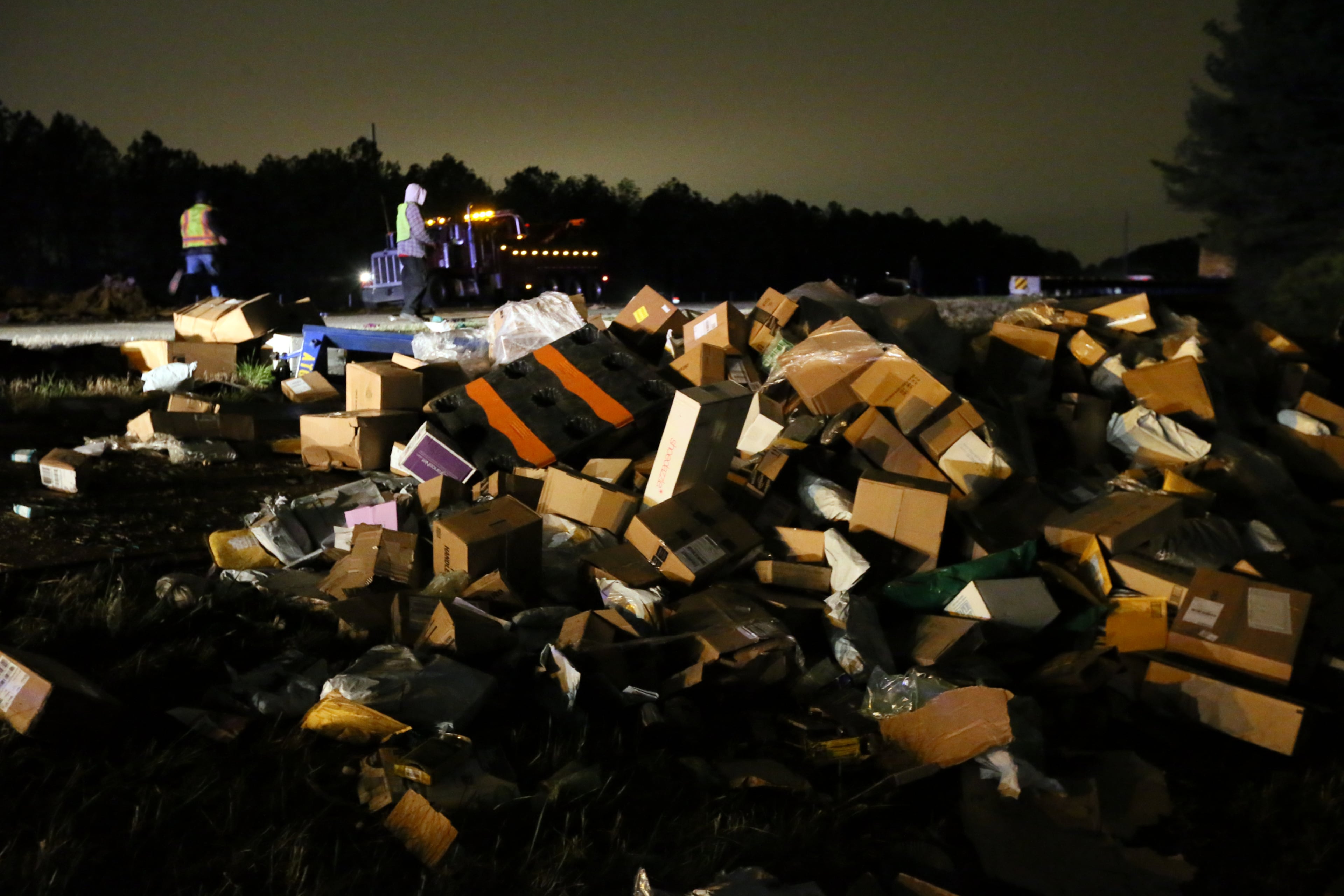 Daniel Hester, an assistant manager with the state Department of Transportation’s HERO units, told the Atlanta Journal-Constitution that a box truck hauling mail parcels collided with a flat-bed truck that was carrying sod. “Both truck lost their loads in the roadway and both ended up off the roadway, one to the right and one to the left,” Hester said. He said only one minor injury was reported.