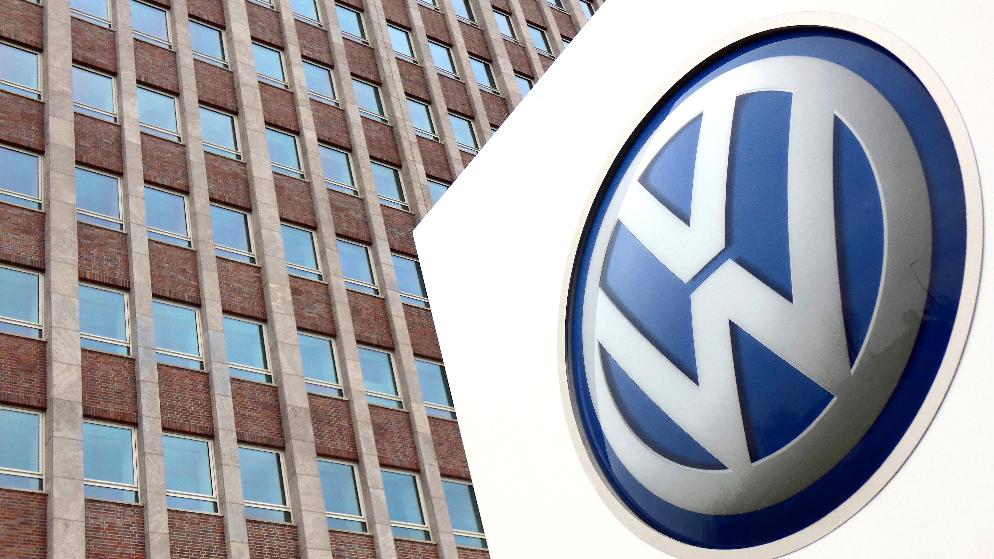 FILE - In this April 13, 2018 file photo, Volkswagen logo is pictured in front of a company building in Wolfsburg, Germany. (AP Photo/Michael Sohn, File)