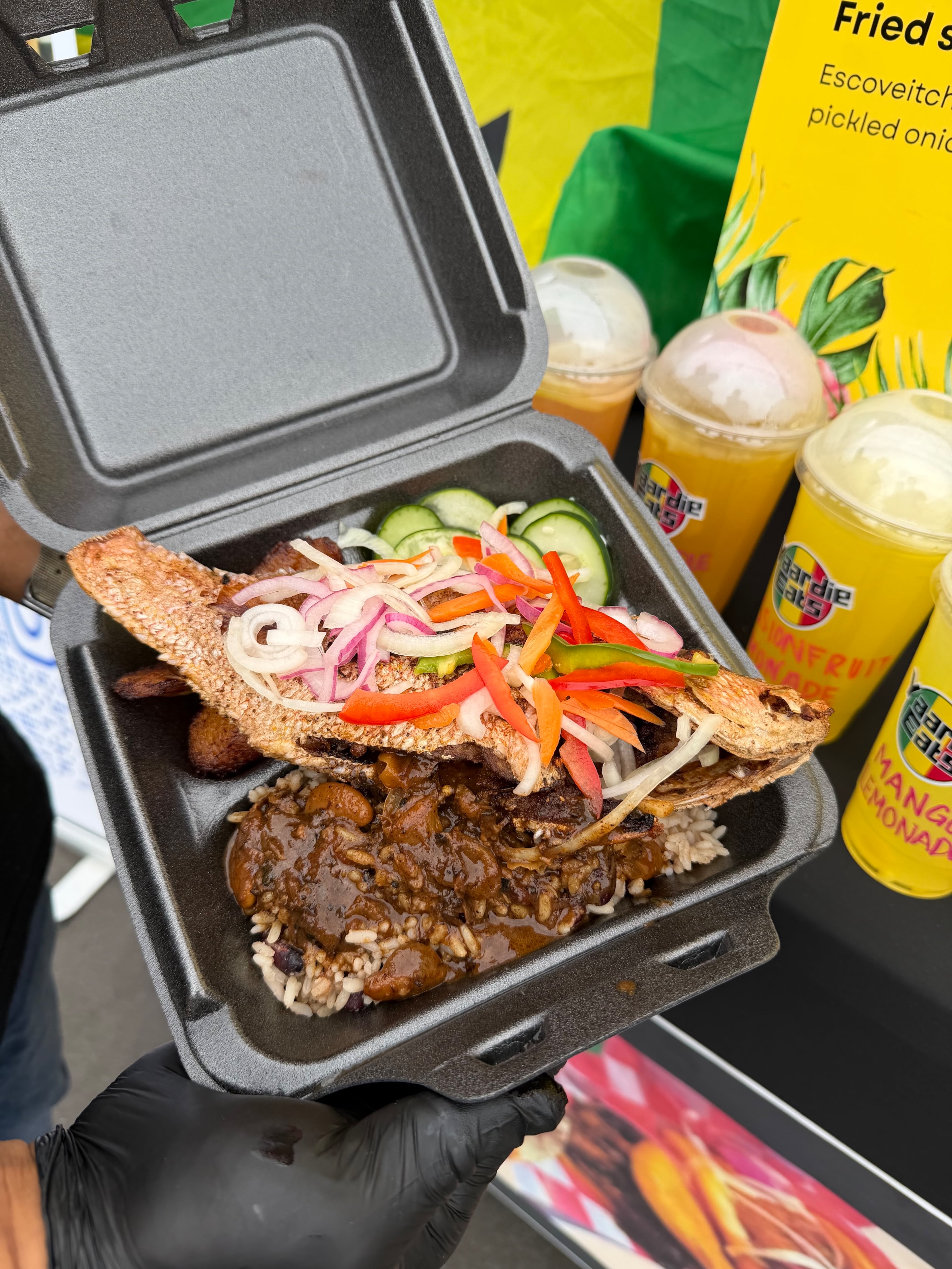 Yaardie Eats offers a fried red snapper with escovitch vegetables and oxtail gravy on rice. (Courtesy of Yaardie Eats)
