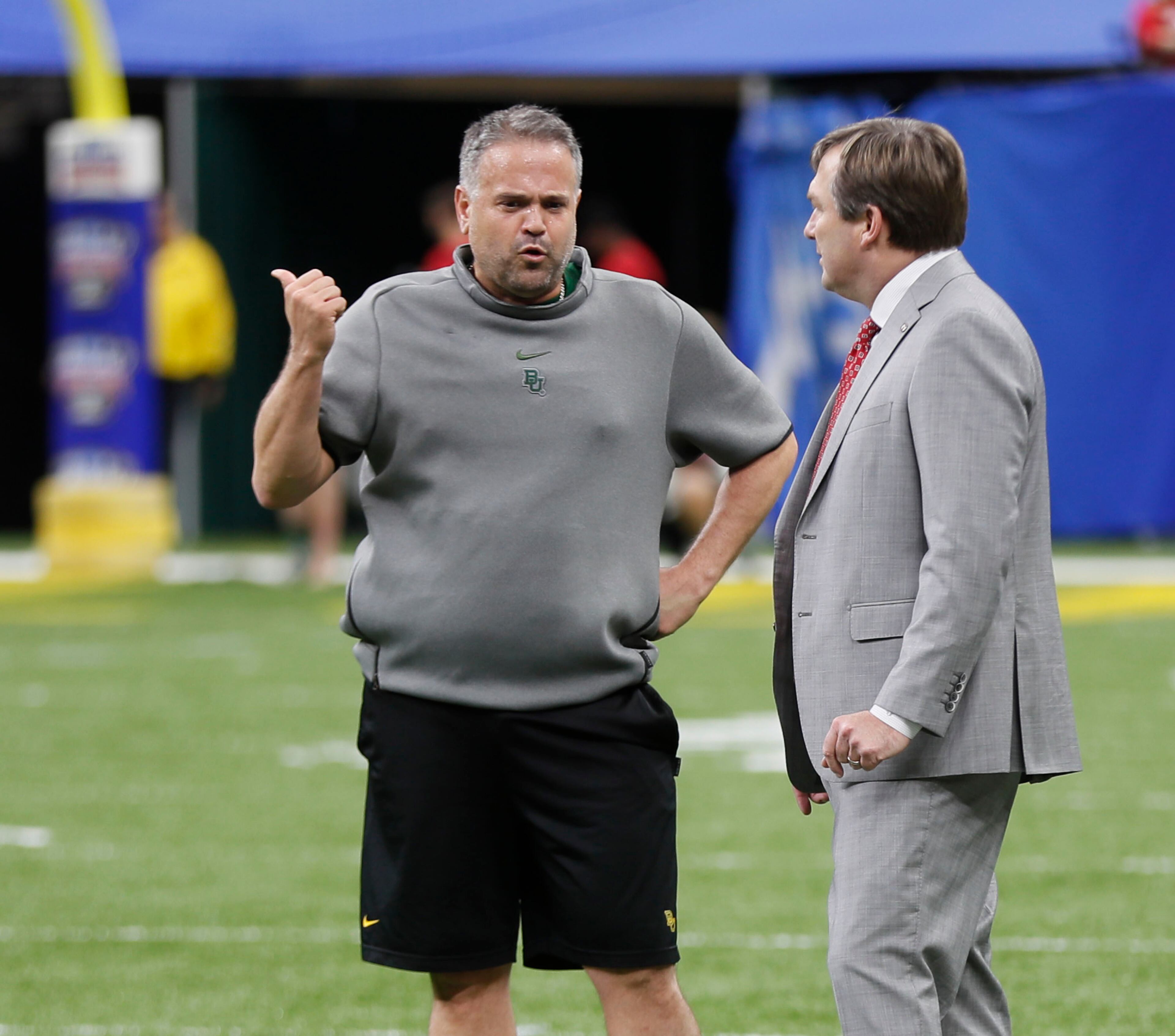 Georgia Bulldogs head coach Kirby Smart (right) stops to talk with Baylor Bears head coach Matt Rhule. Bob Andres bandres@ajc.com