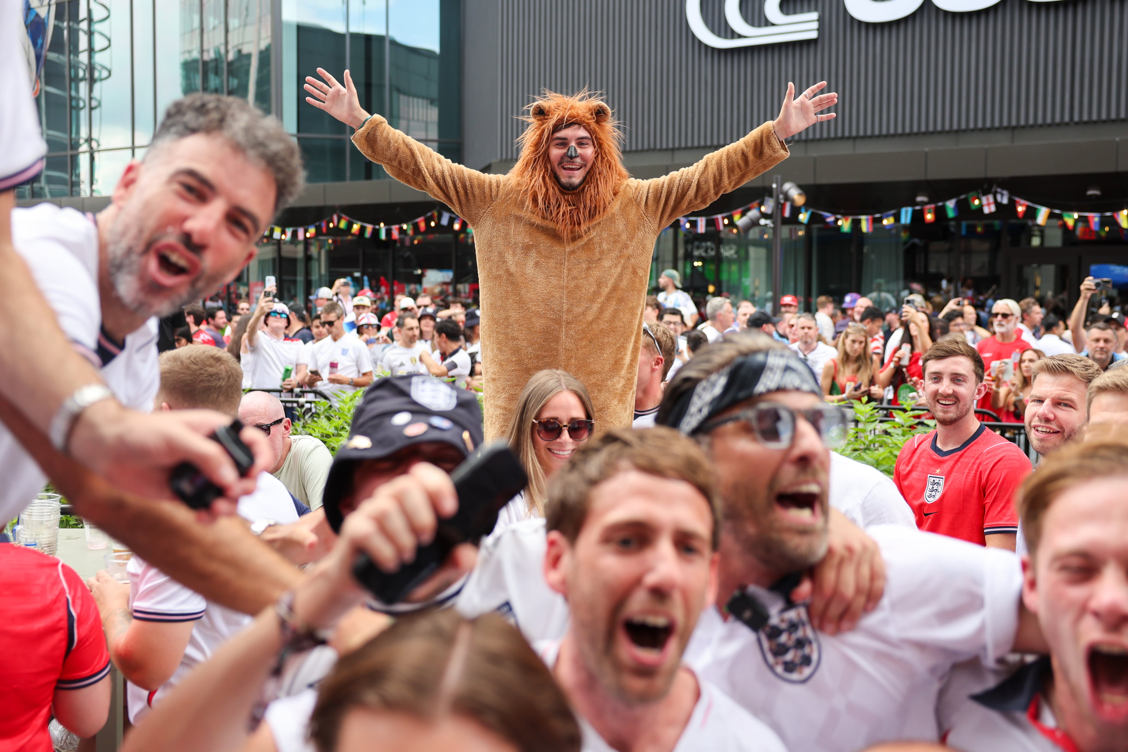 England fans celebrate at Irish Exit before the FIFA World Cup game against Argentina in Atlanta on July 15, 2026. It’s the final World Cup match Atlanta is hosting. (Arvin Temkar/AJC)