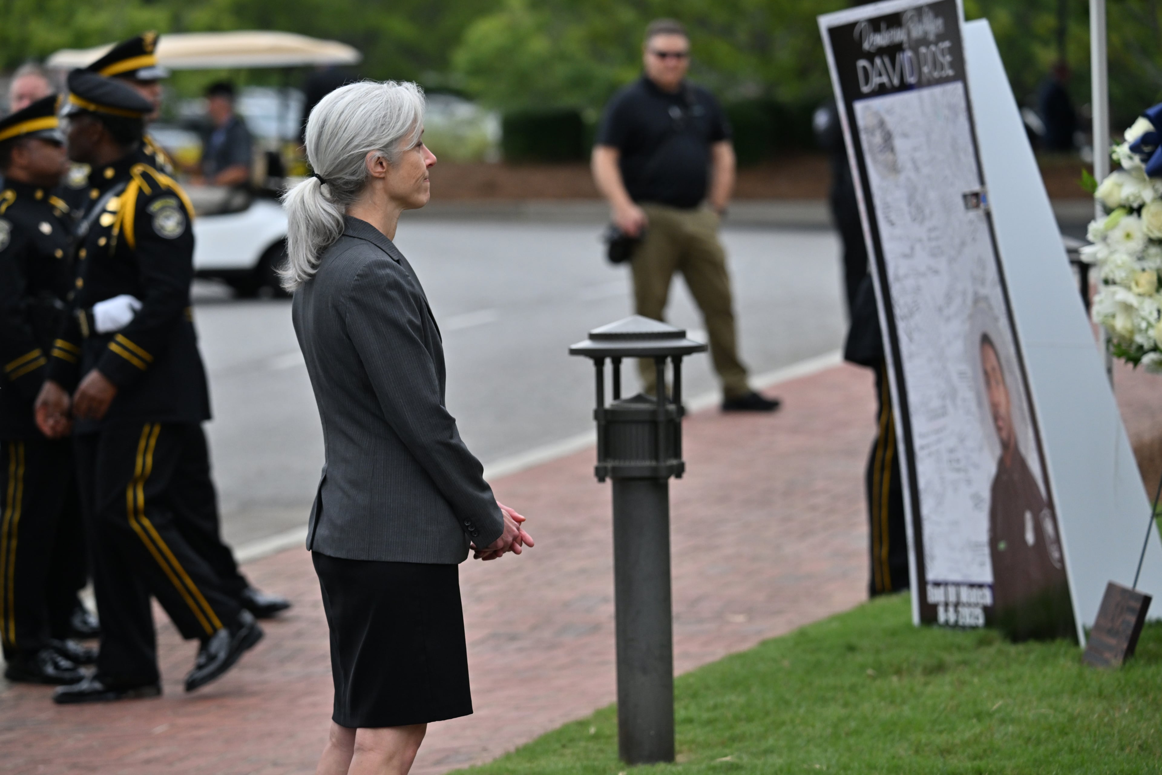 CDC director Susan Monarez takes a moment at a memorial for fallen DeKalb County Police Officer David Rose before the Memorial service for DeKalb County police Officer David Rose, who was killed while responding to the Aug. 8 shooting at the CDC, at First Baptist Church Atlanta, Friday, August 22, 2025, in Atlanta. Hyosub Shin / AJC)