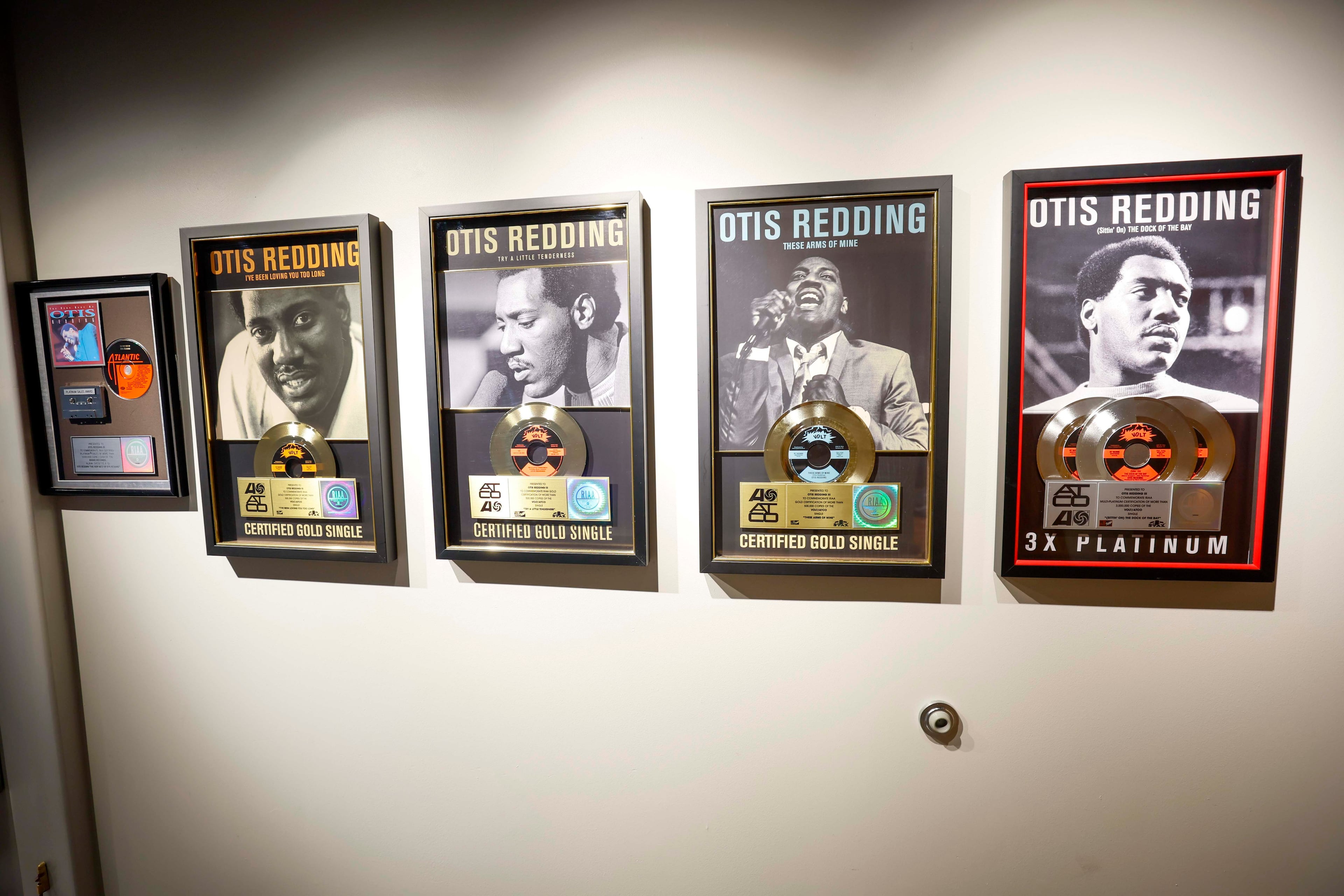 Framed photos of the legendary soul singer hang on along a wall of the Otis Redding Center for the Arts in Macon. (Miguel Martinez/AJC)