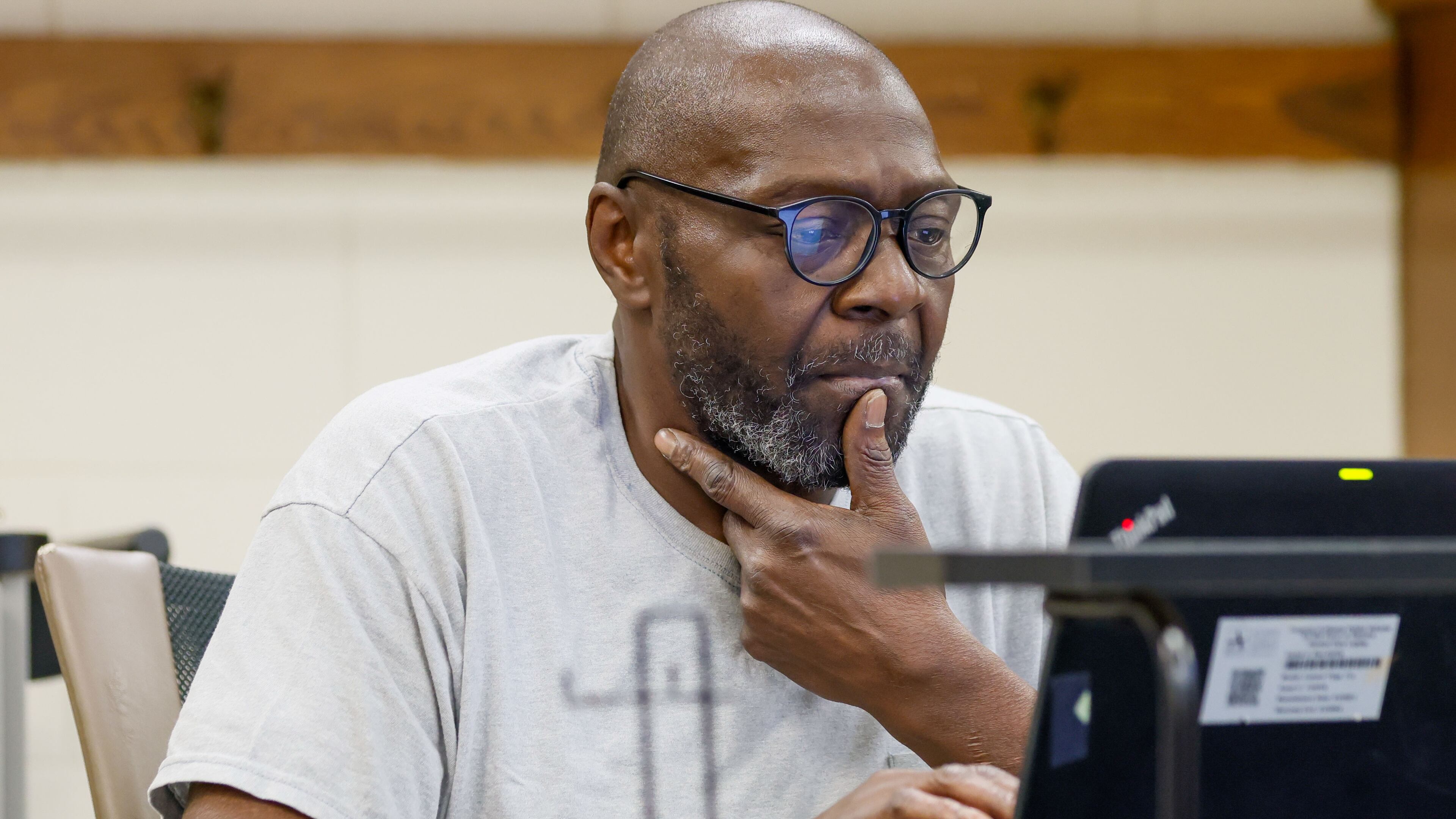James Mullins, 62, focuses on his laptop during a class at the APS Adult Education Center in southeast Atlanta on Wednesday, Feb. 28, 2024. (Miguel Martinez / miguel.martinezjimenez@ajc.com)