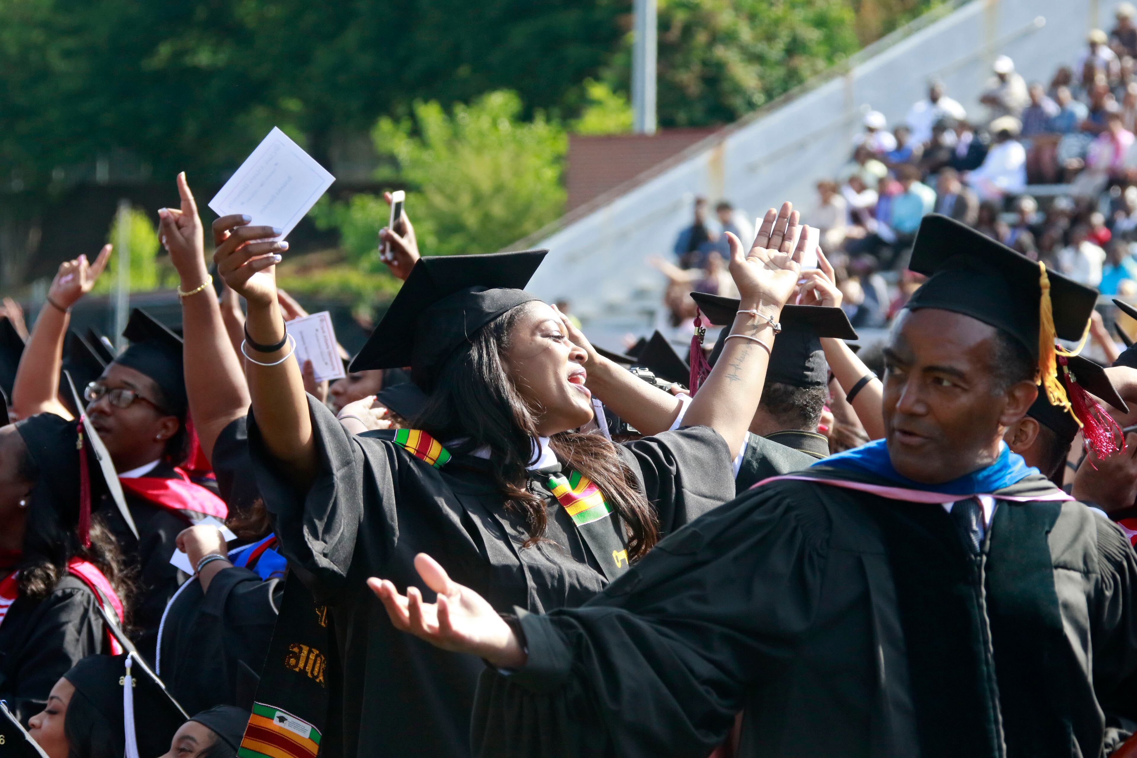 May 16, 2016 - Atlanta - Graduates join in singing as the choir performs "Purple Rain." Clark Atlanta University class of 2016 filled Panther Stadium Monday morning for it's 27th annual Commencement Service. The keynote speaker was retired astronaut Mae Jemison, the first woman of color in Space. Honorary degrees were awarded to Hamilton Bohannon, a 1964 graduate of Clark College; Roland Carter; Congressman John Conyers, and Congressman Hank Johnson, a 1976 Clark College graduate. BOB ANDRES / BANDRES@AJC.COM