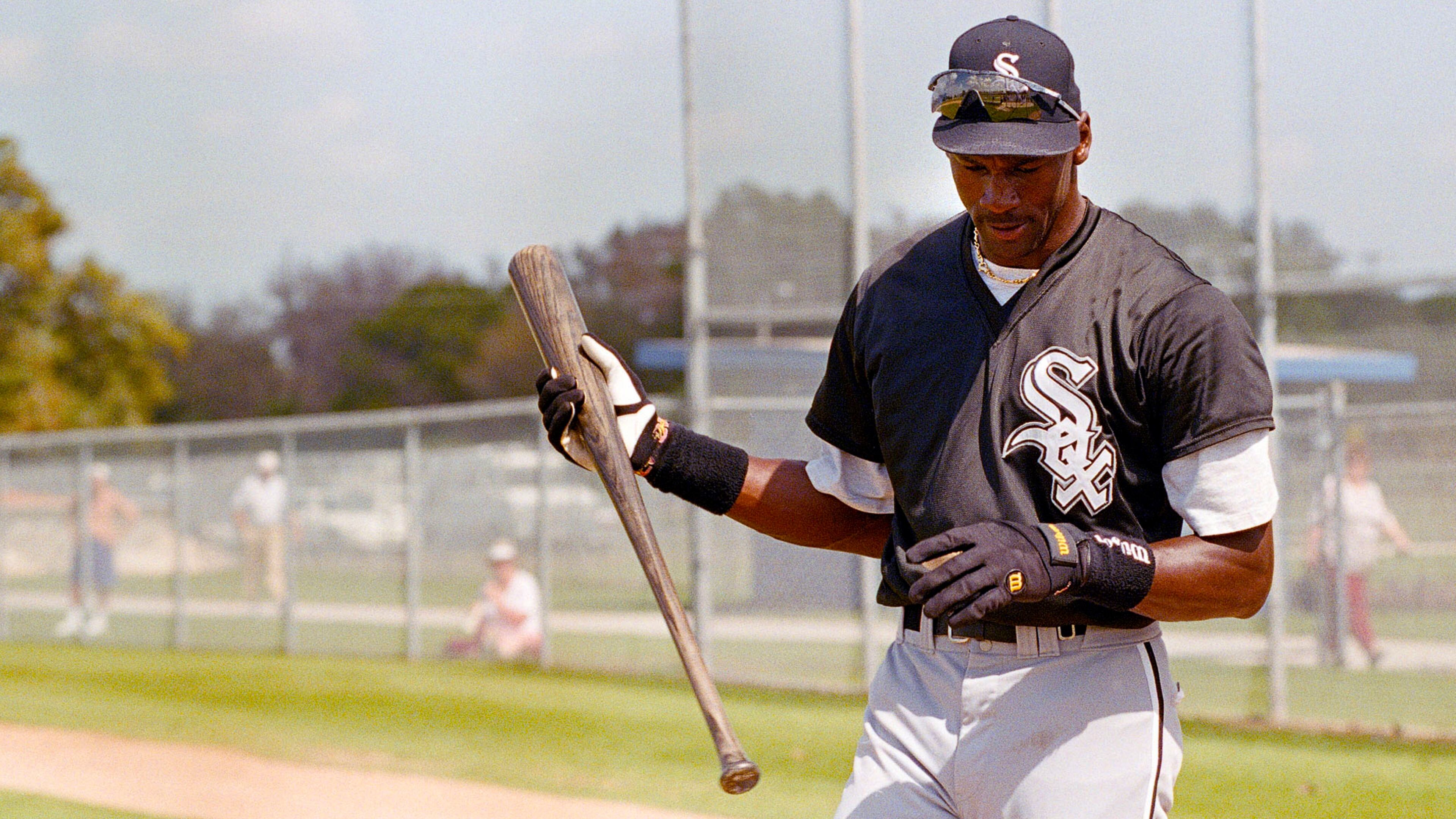 Chicago White Sox minor-leaguer Michael Jordan looks at his hand as he finishes batting practice, Monday, Feb. 27, 1995, Sarasota, Fla. Jordan participated in the White Sox spring training before returning to the NBA.