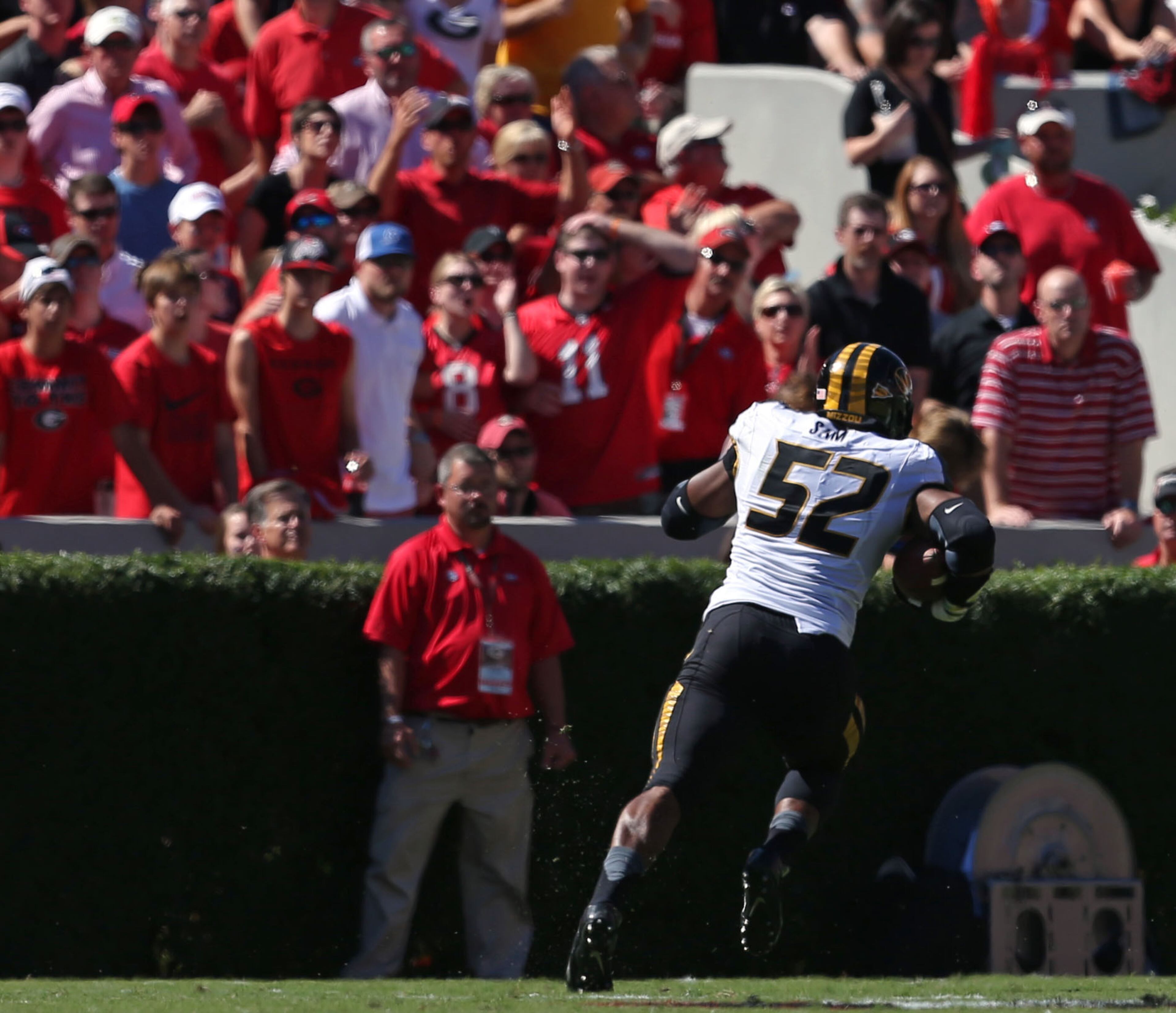 Missouri defensive lineman Michael Sam (52) returns a fumble for a touchdown against Georgia on October 12, 2013.