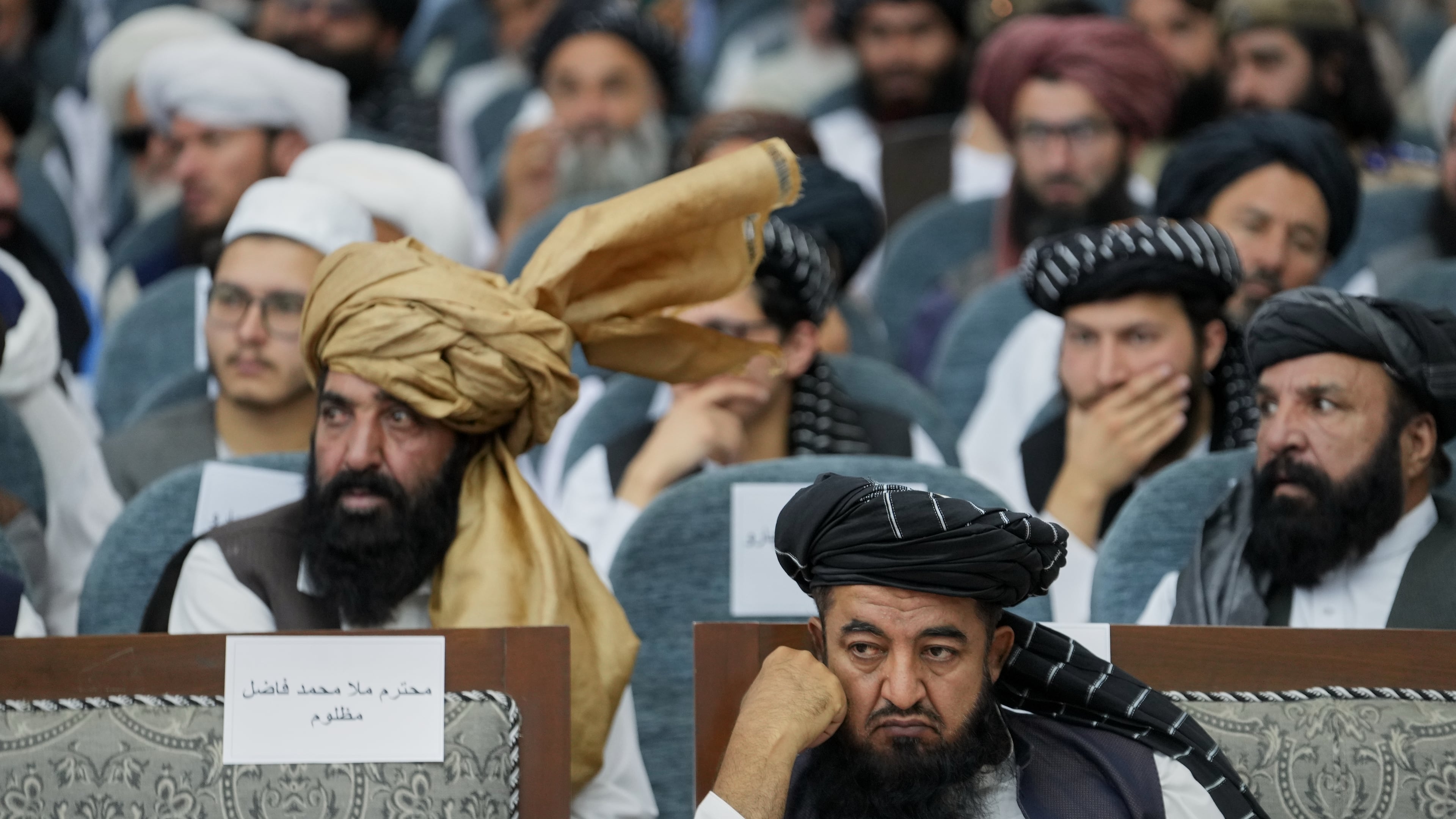 Taliban delegates from across the country attend a meeting that opens celebrations marking the fifth anniversary of the U.S. withdrawal and the start of Taliban rule, at the Loya Jirga Hall in Kabul, Afghanistan, Saturday, Aug. 15, 2026. (AP Photo/Siddiqullah Alizai)