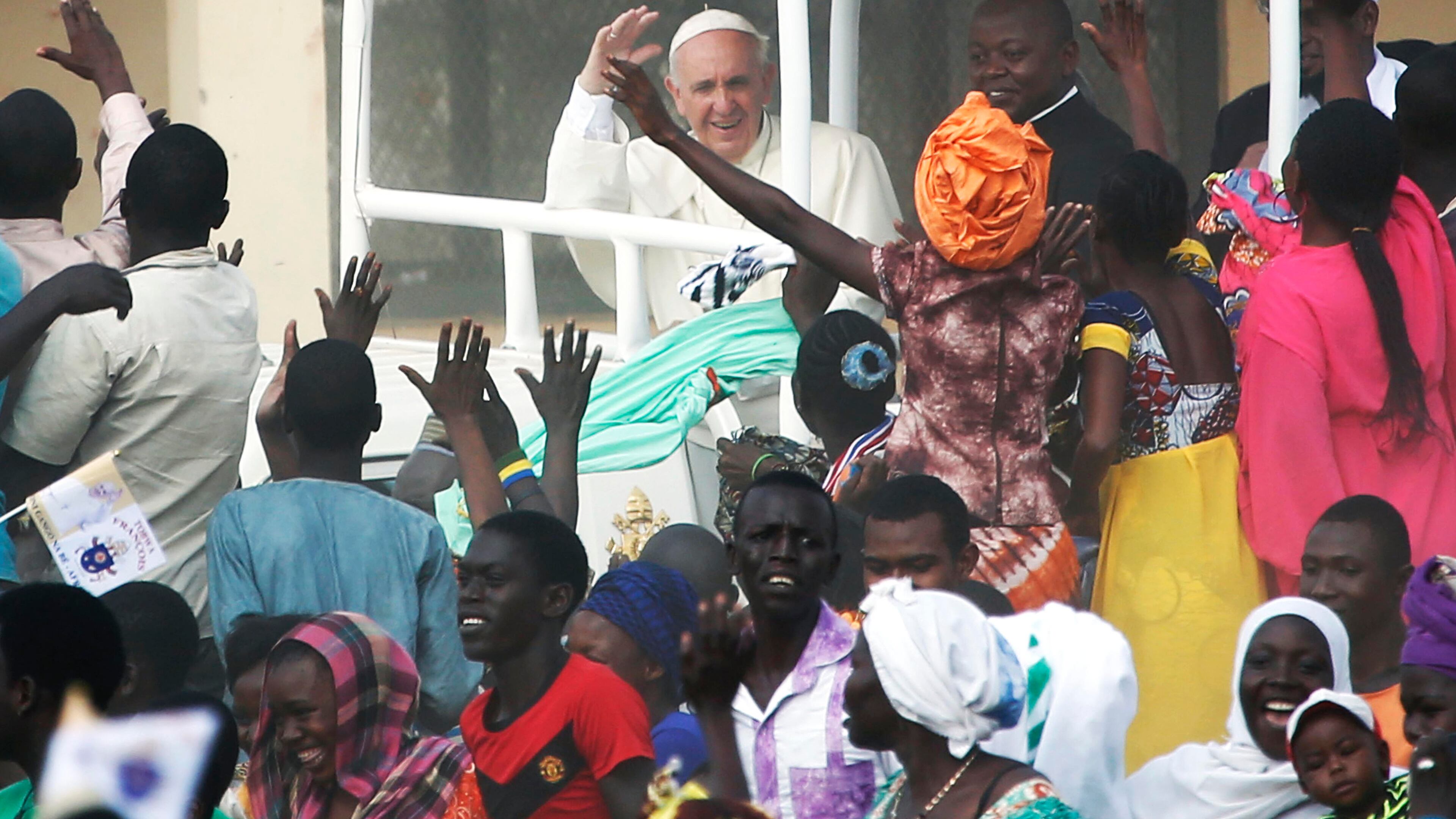 FILE - Pope Francis waves to the crowd on the occasion of his visit at the Central Mosque in Bangui's Muslim enclave of PK5, Central African Republic, on Nov. 30, 2015. (AP Photo/Jerome Delay, File)