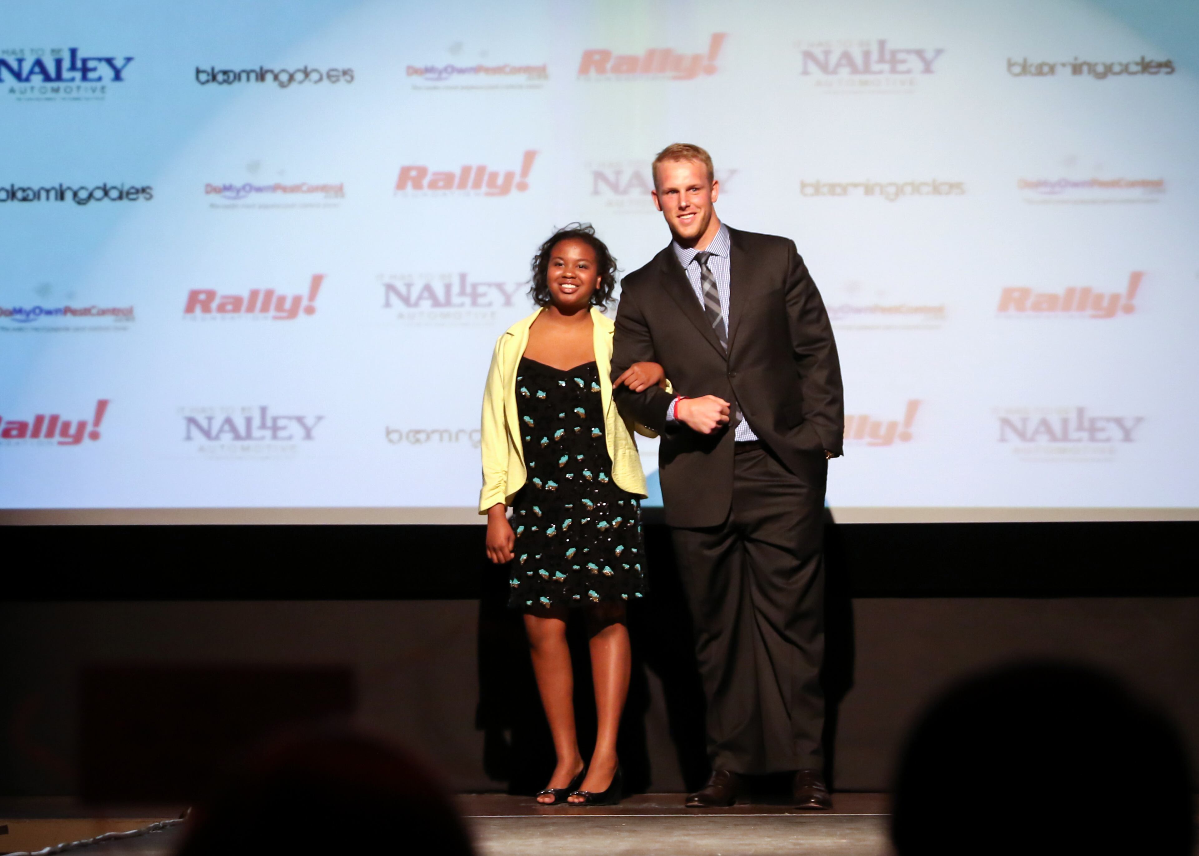 Atlanta Falcons fullback Patrick Dimarco escorts Sydney in the 6th annual Rally on the Runway fashion show at the Buckhead Theatre on Friday, April 24, 5015. The event helped raise $200,000 for the Rally Foundation for Childhood Cancer Research. Photography by Lauren Chambers.