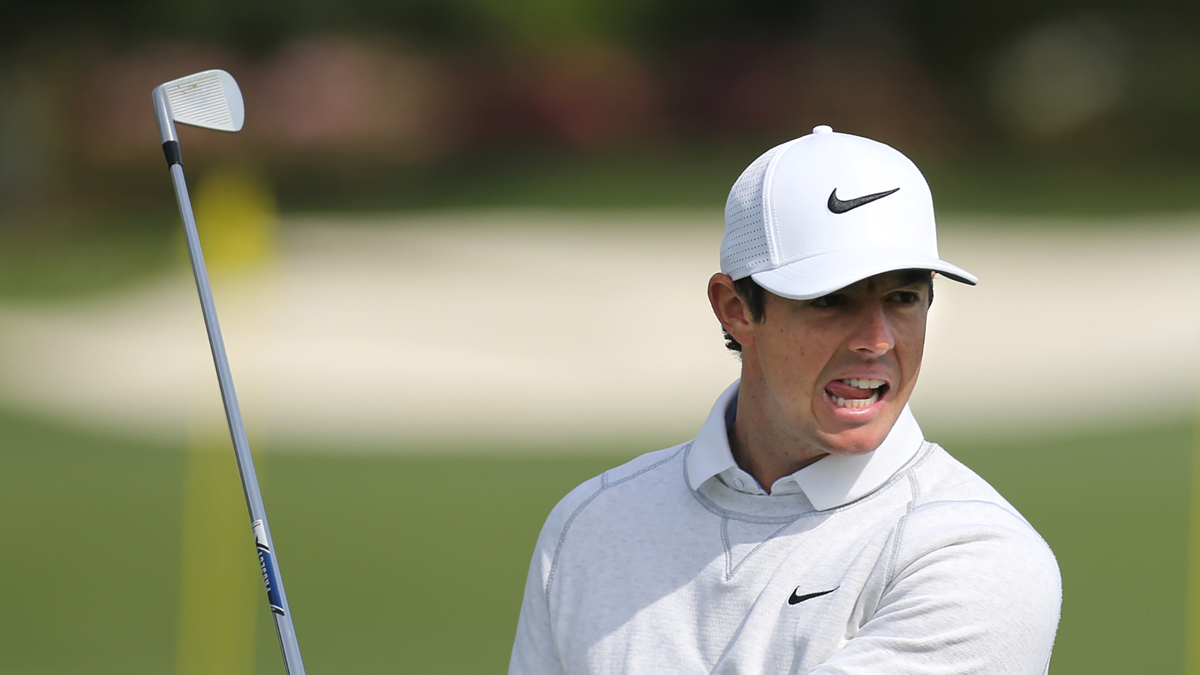 Rory McIlroy reacts to an iron shot while practicing for the opening round of the Masters at Augusta National Golf Club on Wednesday in Augusta. Curtis Compton / ccompton@ajc.com