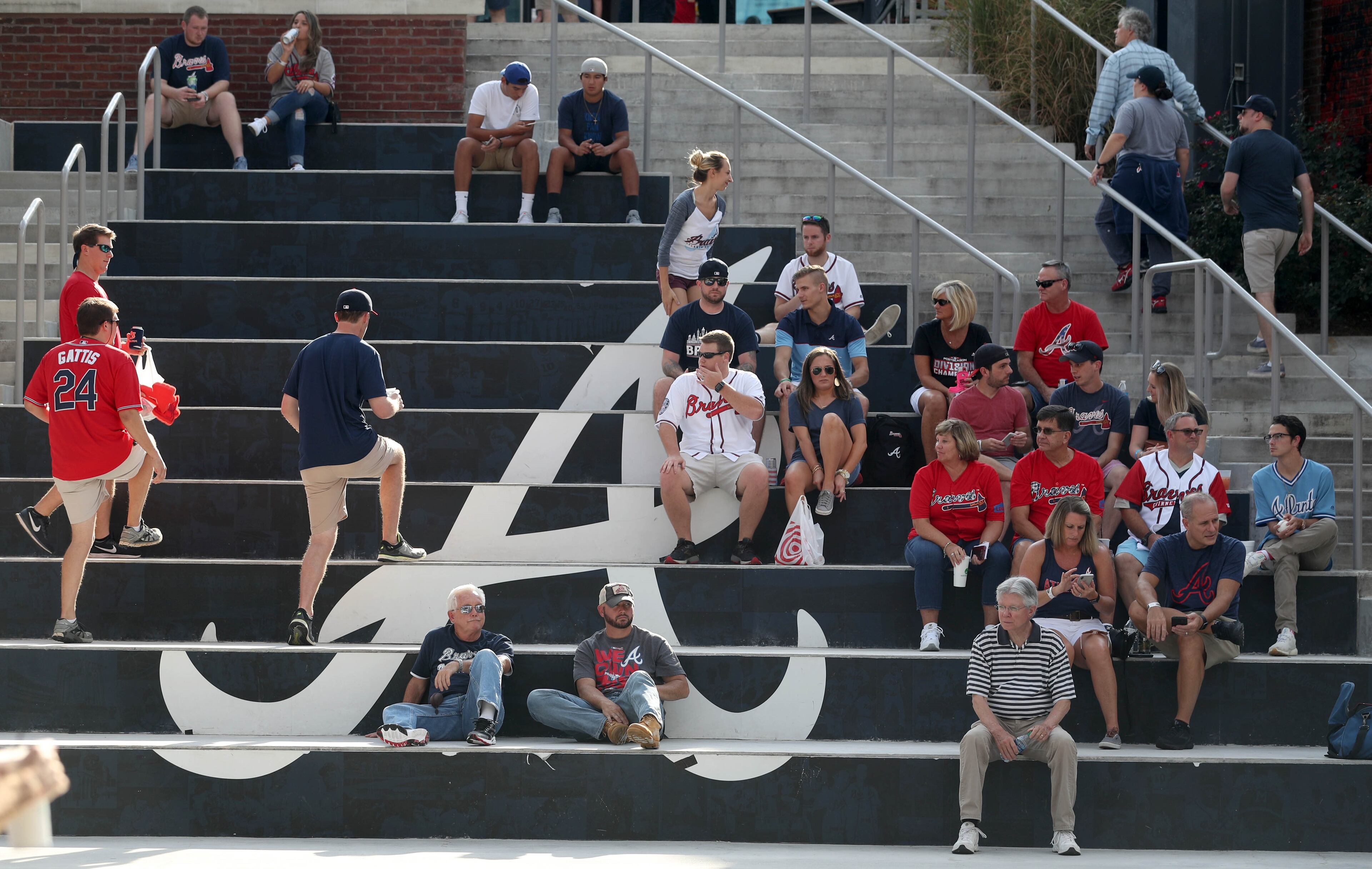 October 7, 2018 - Atlanta: Atlanta Braves fans gather in the plaza before Game 3 between the Atlanta Braves and the Los Angeles Dodgers in a National League Division Series baseball game Sunday, October 7, 2018, in Atlanta. (JASON GETZ/SPECIAL TO THE AJC)
