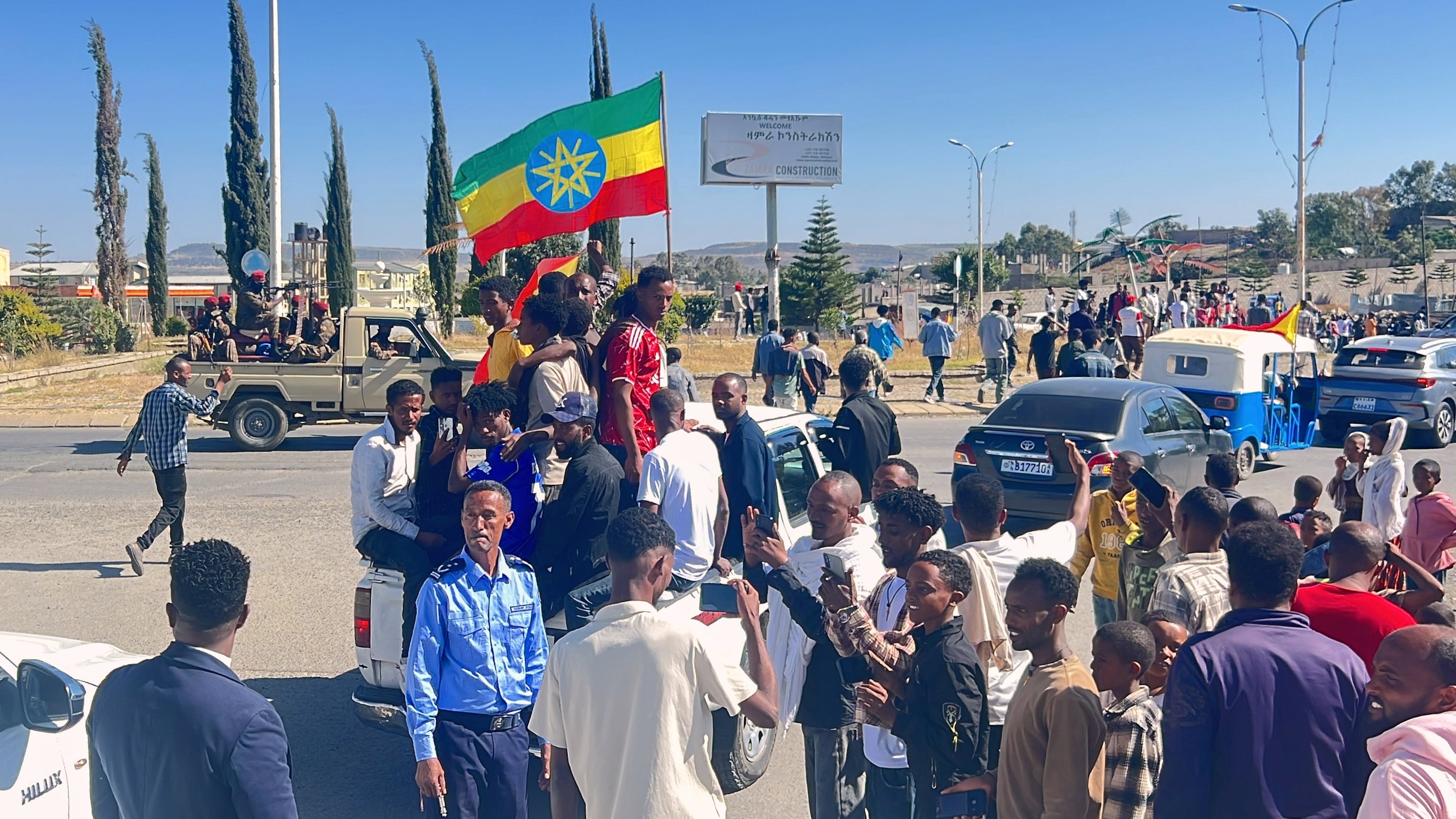 In this photo taken with a smartphone, supporters gather to welcome former Tigray leader Getachew Reda in Mekelle, Ethiopia, Sunday, Oct. 11, 2026. (AP Photo/Filmon Equar Hailu)