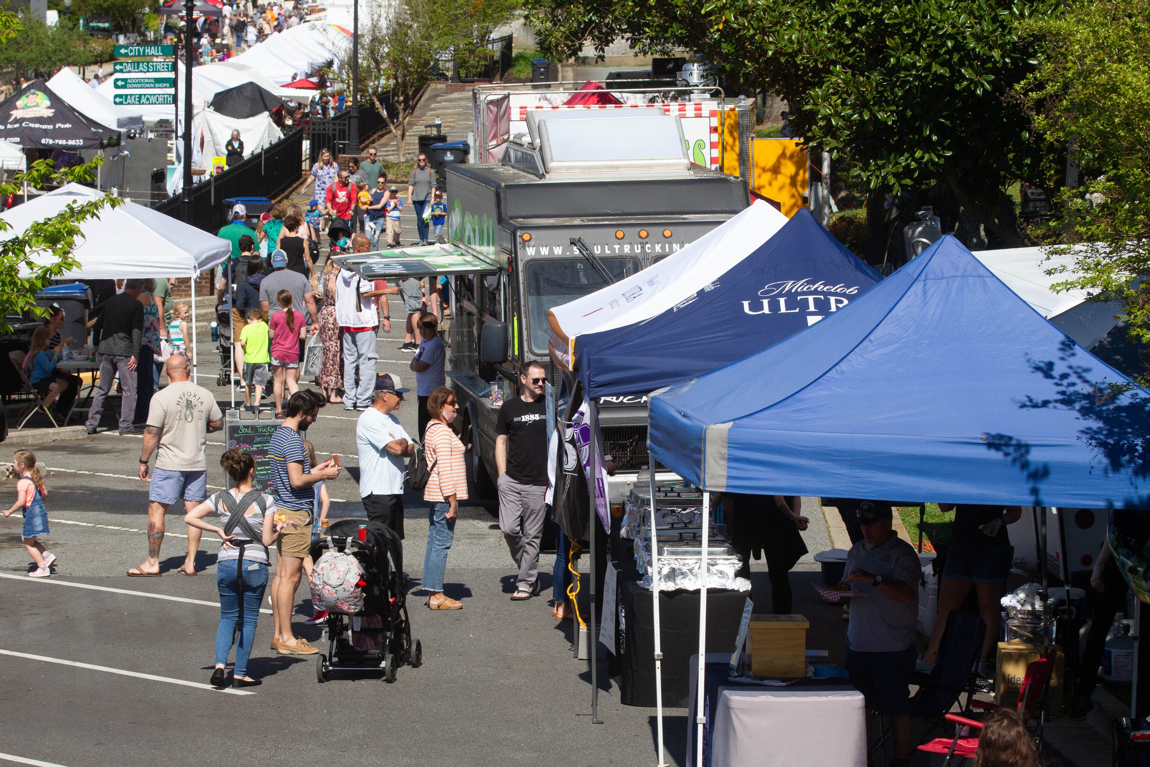People wait in line at the food trucks at the Acworth Art Fest on Sunday, April 11, 2021. (Photo: Steve Schaefer for The Atlanta Journal-Constitution)