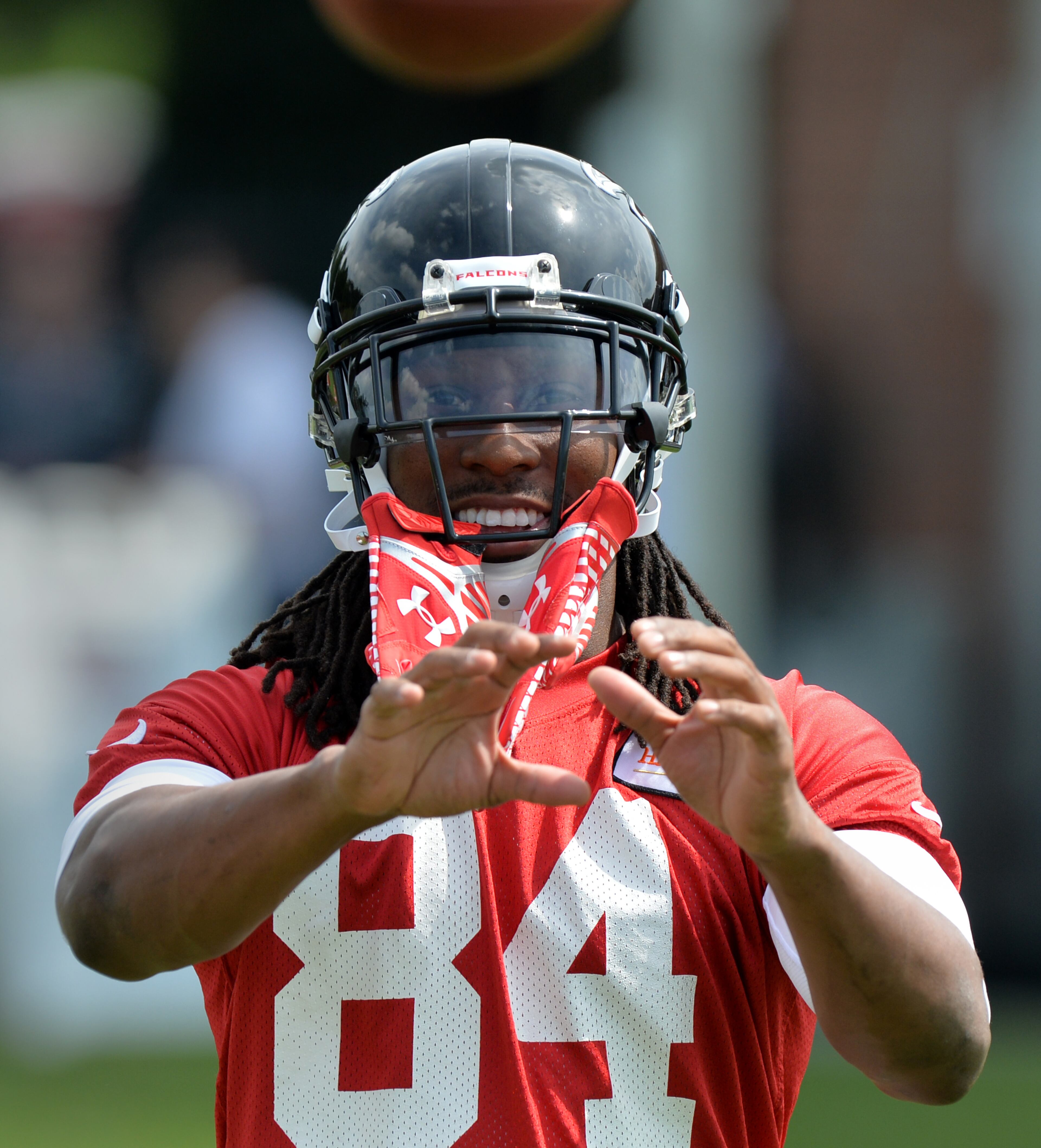 Atlanta Falcons wide receiver Roddy White catches during training camp on Friday, July 25, 2014.