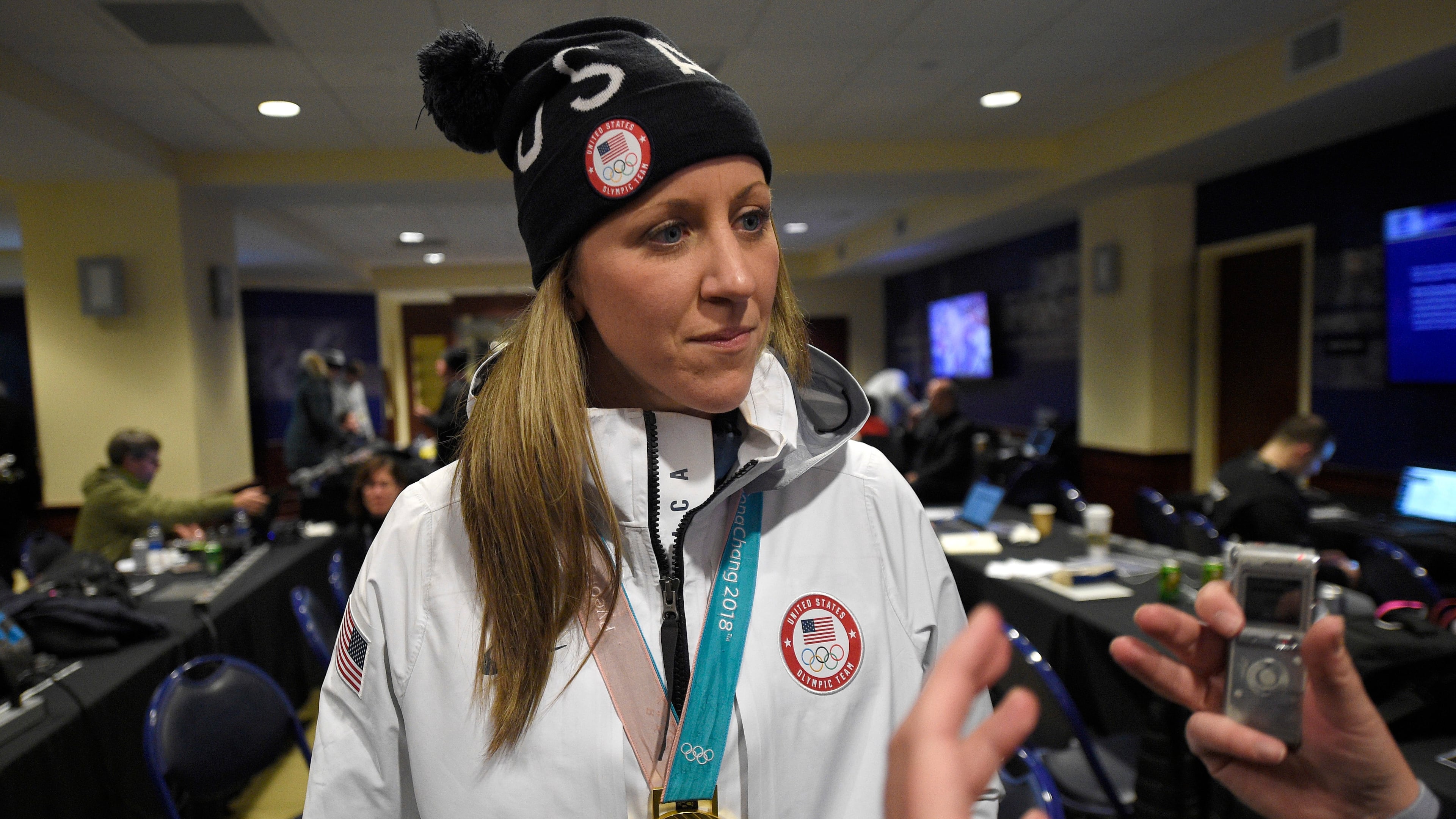 FILE - Meghan Duggan listens to a question from the media, March 3, 2018, in Annapolis, Md. (AP Photo/Nick Wass, File)