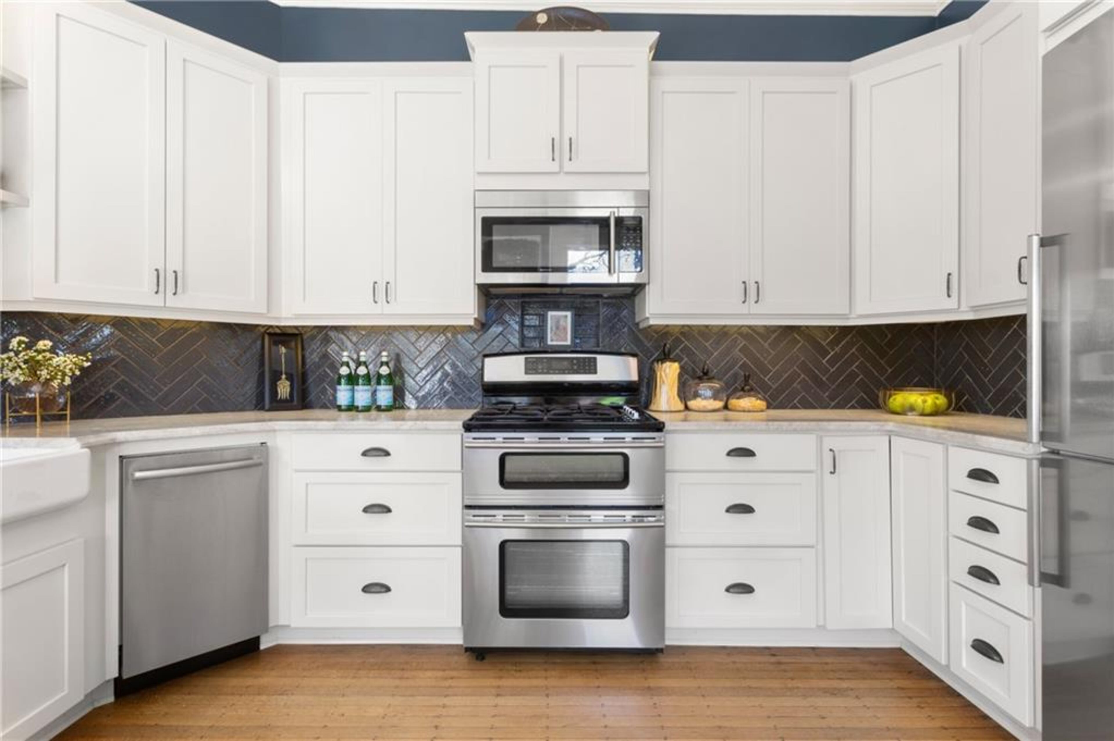 Beautiful white shaker cabinets and marble countertops.