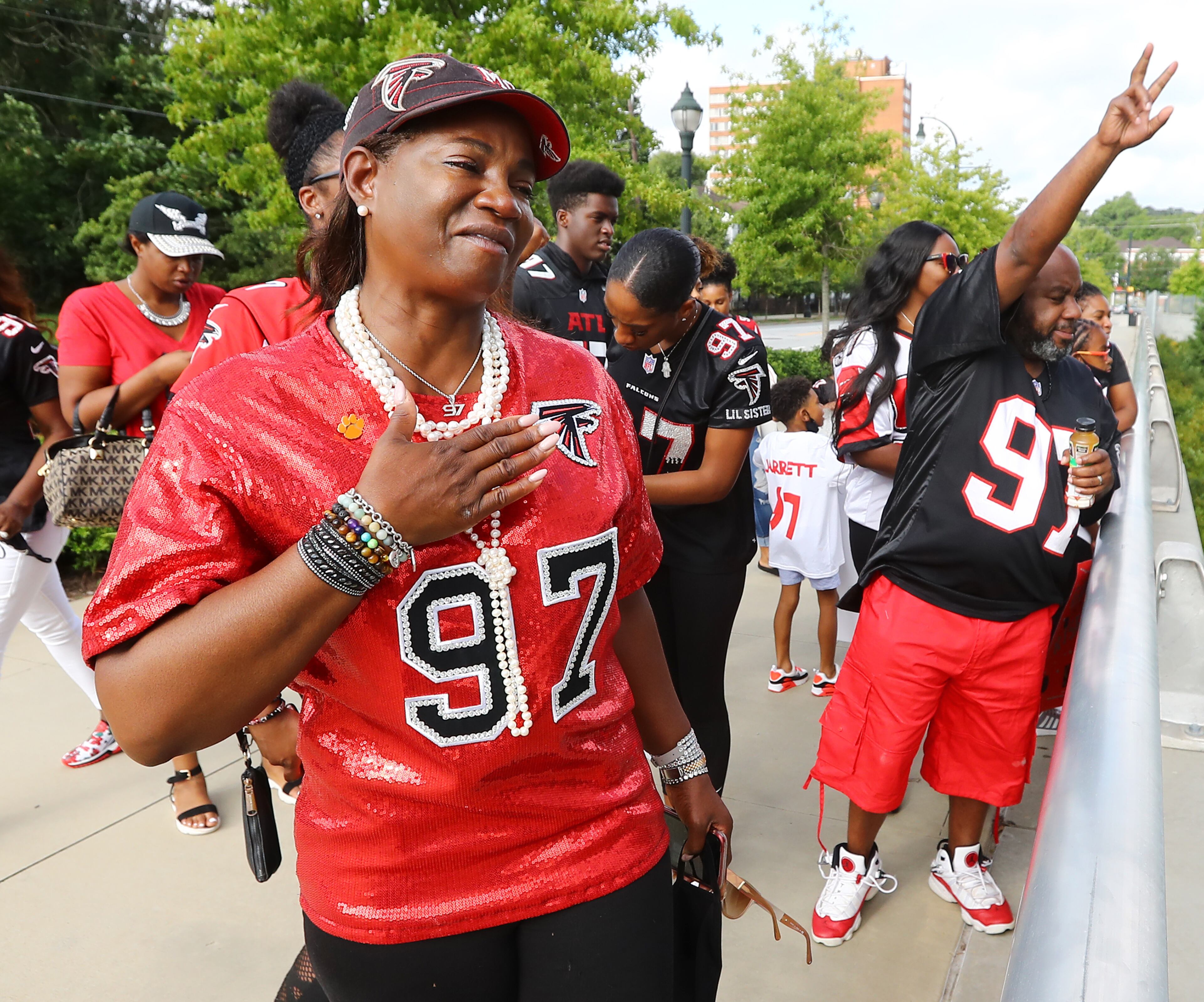 Elisha Jarrett (left), the mother of Atlanta Falcons defensive tackle Grady Jarrett, becomes emotional as his family cheers him on outside Mercedes-Benz Stadium while he arrives to play the Seattle Seahawks in the home opener Sunday, Sept. 13, 2020, in Atlanta. (Curtis Compton/Curtis.Compton@ajc.com)
