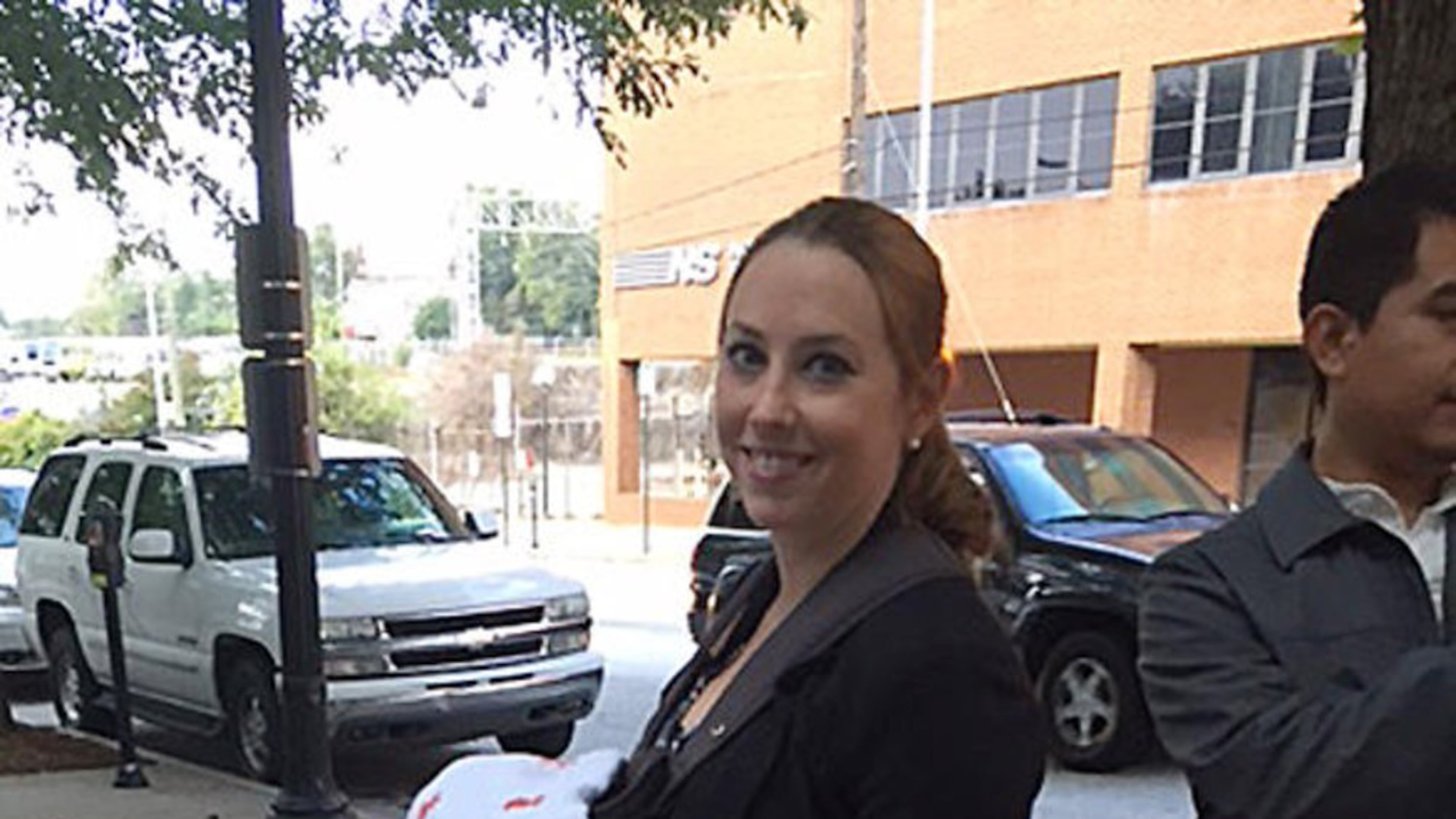 Attorney Stacy Ehrisman-Mickle waits outside immigration court with her month-old daughter after being denied a continuance by Judge J. Dan Pelletier.
