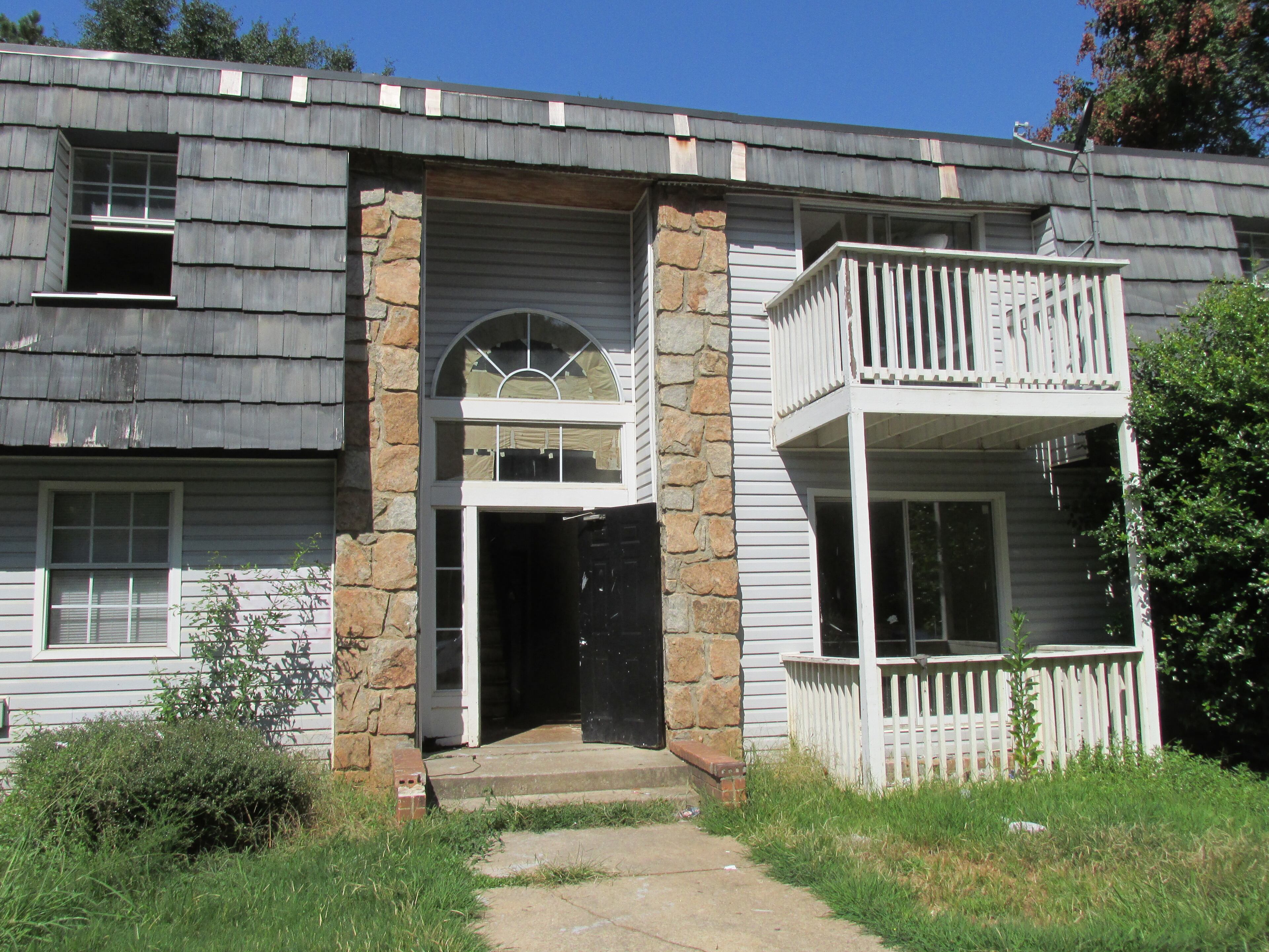 DeKalb Commissioner Nancy Jester on Tuesday called attention to the condition at Creekside Forest apartments off I-20, which she said have been failed by the county and management. (Photo by Joshua Sharpe)