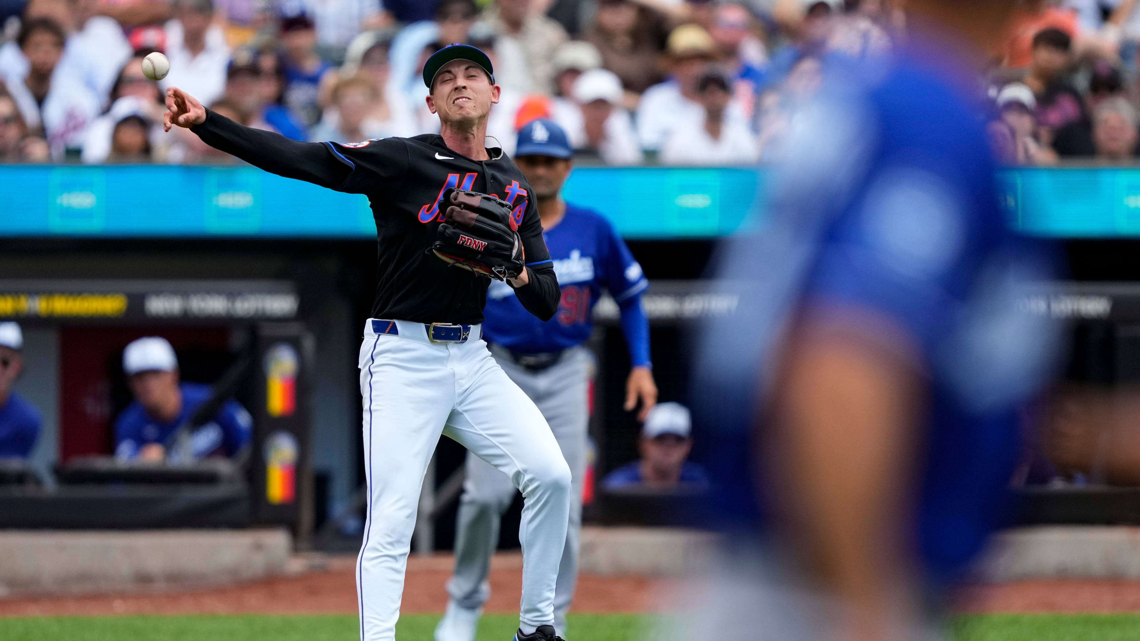 New York Mets pitcher Luke Weaver throws out Los Angeles Dodgers' Teoscar Hernández at first base during the eighth inning of a baseball game, Sunday, July 26, 2026, in New York. (AP Photo/Yuki Iwamura)